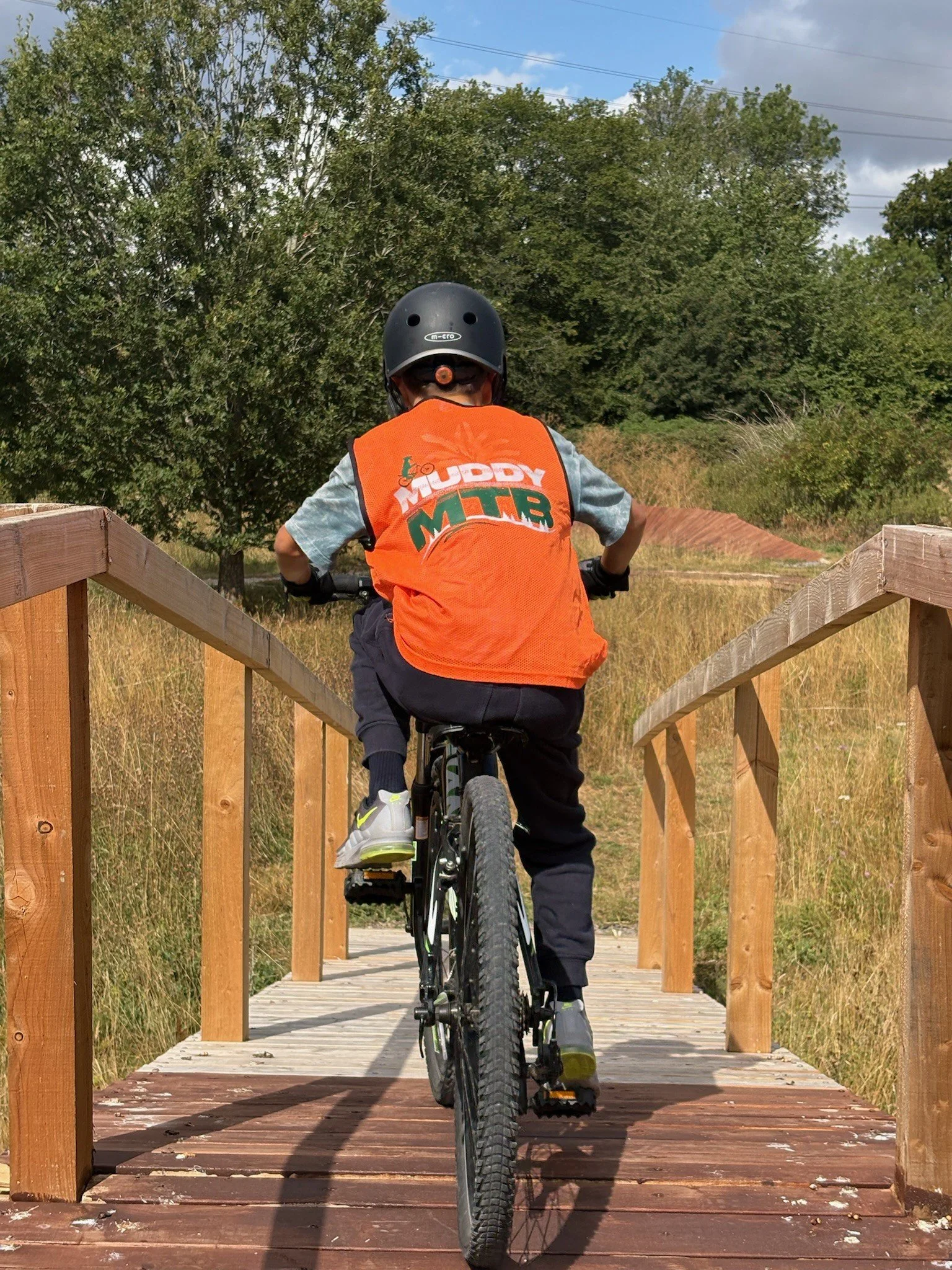 A child riding a bike having a mountain bike session at Muddy MTB in Amersham, Bucks
