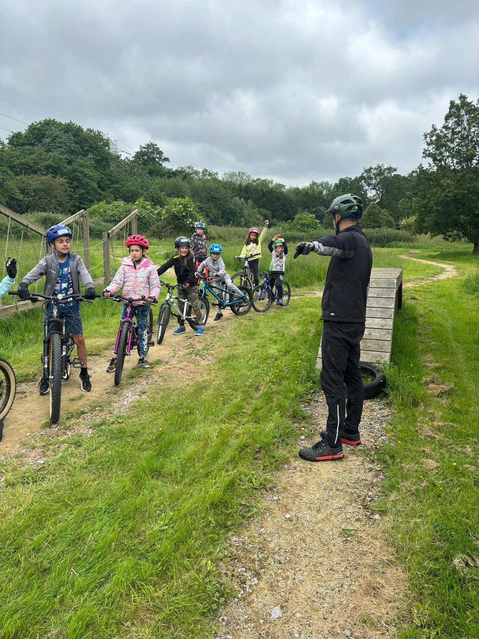 Children with instructor waiting to ride 
