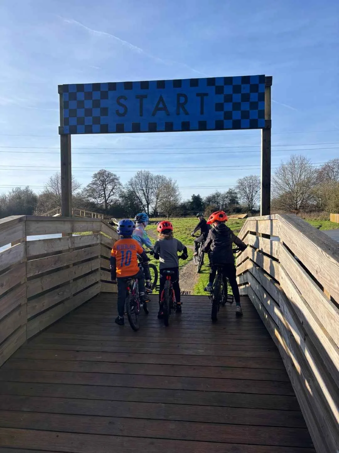 Children riding a mountain bike during a Muddy MTB coaching session in Amersham, Buckinghamshire