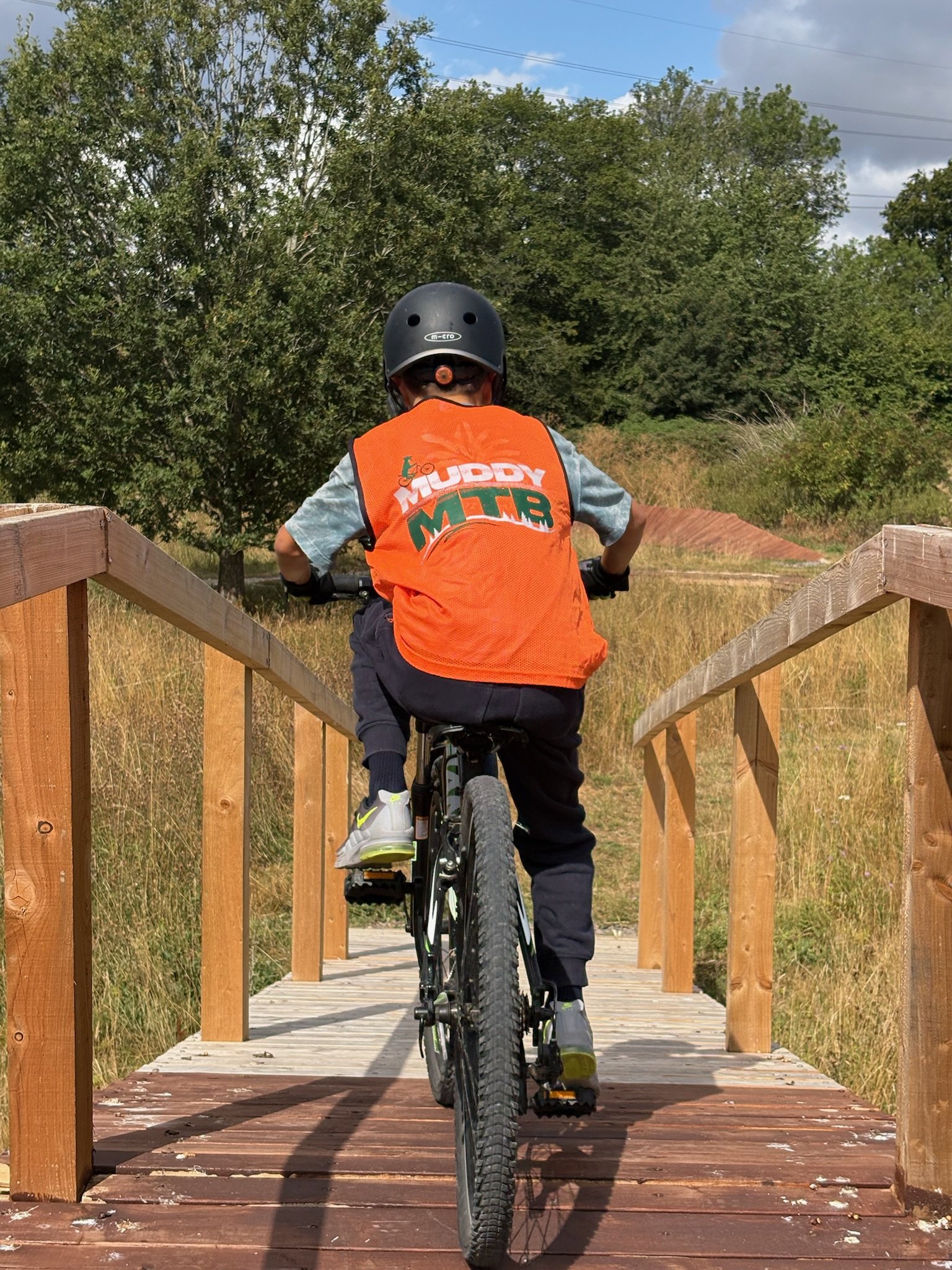 A child riding a mountain bike at a Muddy MTB Session in Amersham, Bucks