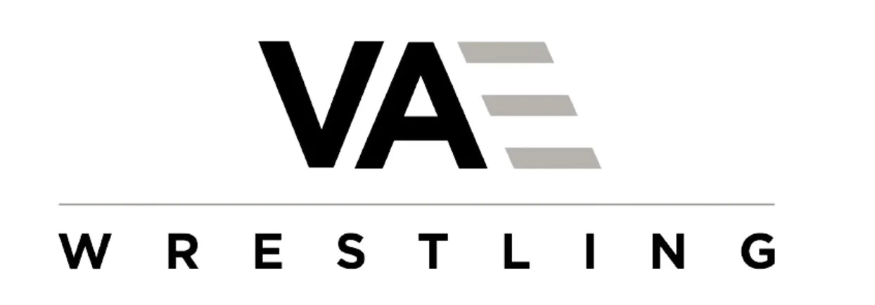 Logo of VA Wrestling, with a stylized 'VA' with three gray lines to the right and the word 'WRESTLING' below.