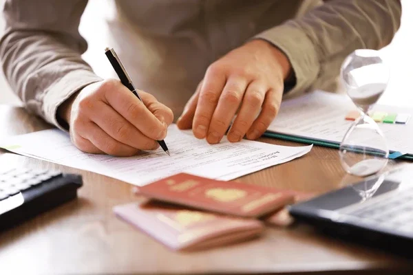 Client completing legal DNA testing paperwork for immigration or court use in Dorset.