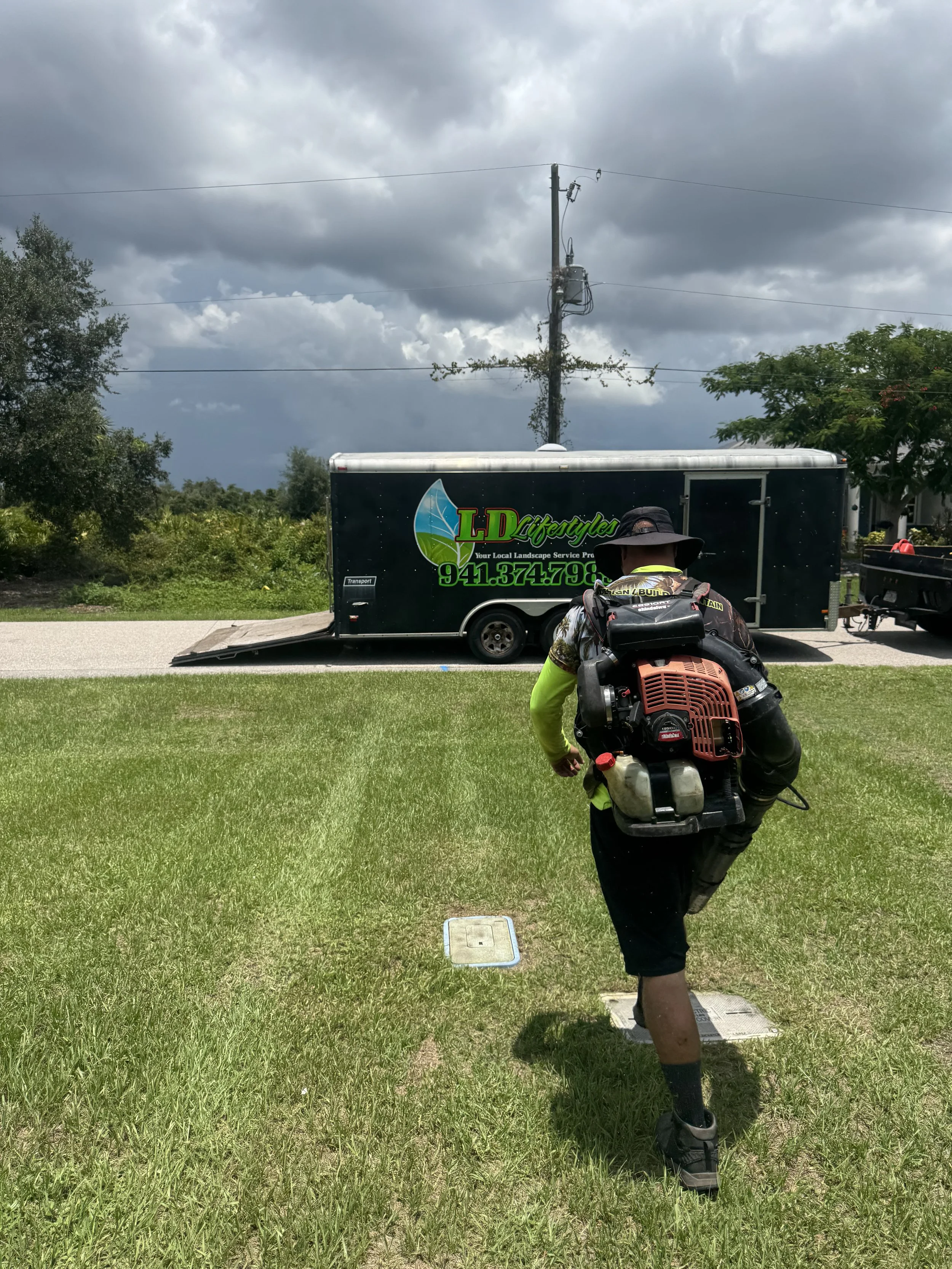 LD LIFESTYLES TEAM BLOWING OFF AFTER MOWING LAWN.