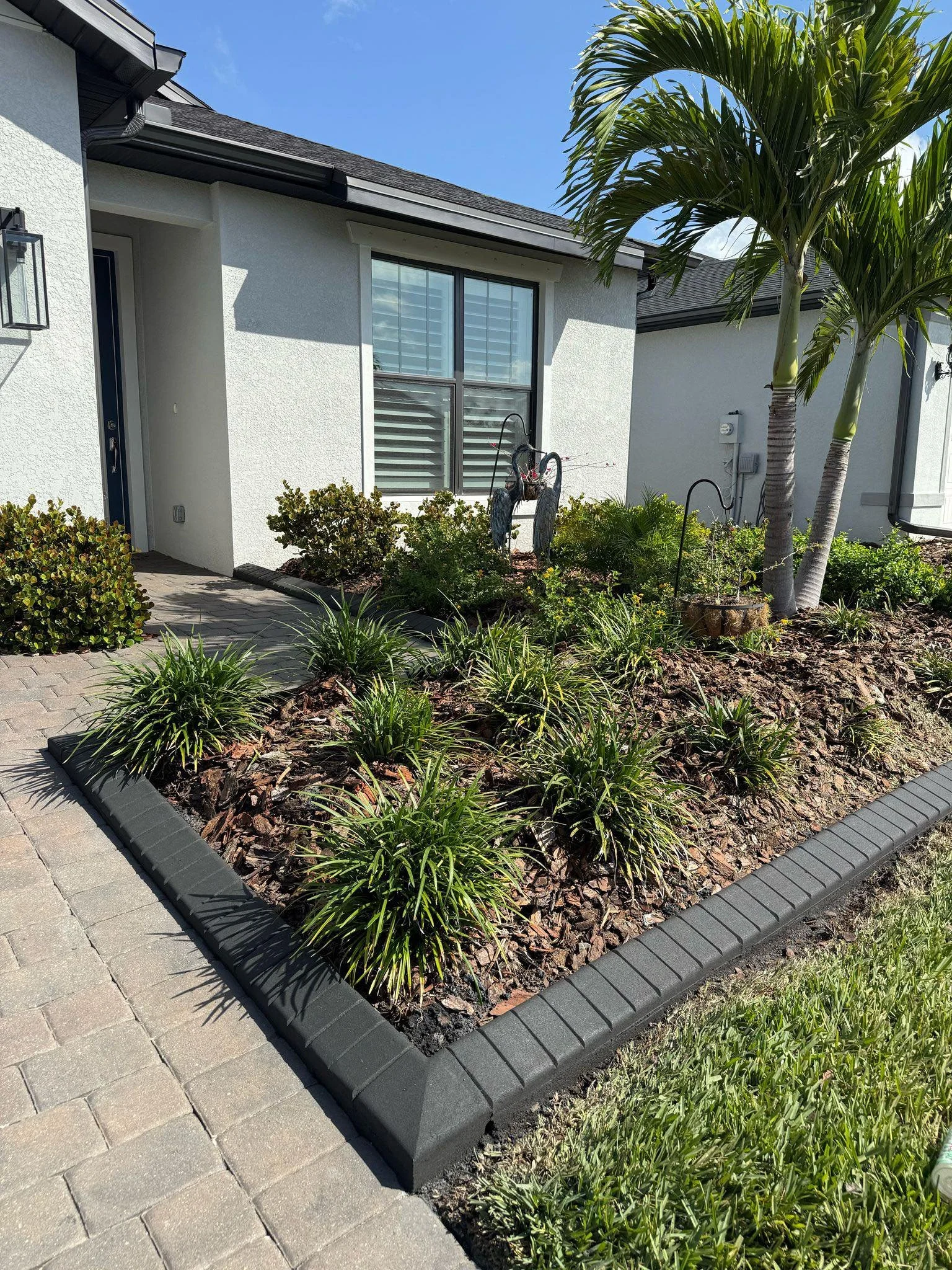 Concrete curbing installation in front yard by LD Lifestyles at home in Port Charlotte Florida.