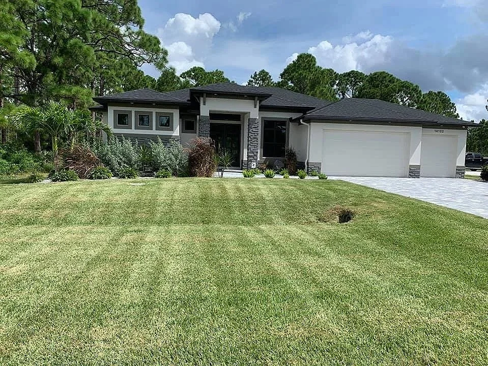 LD Lifestyles maintaining a St. Augustine lawn in Port Charlotte Florida.