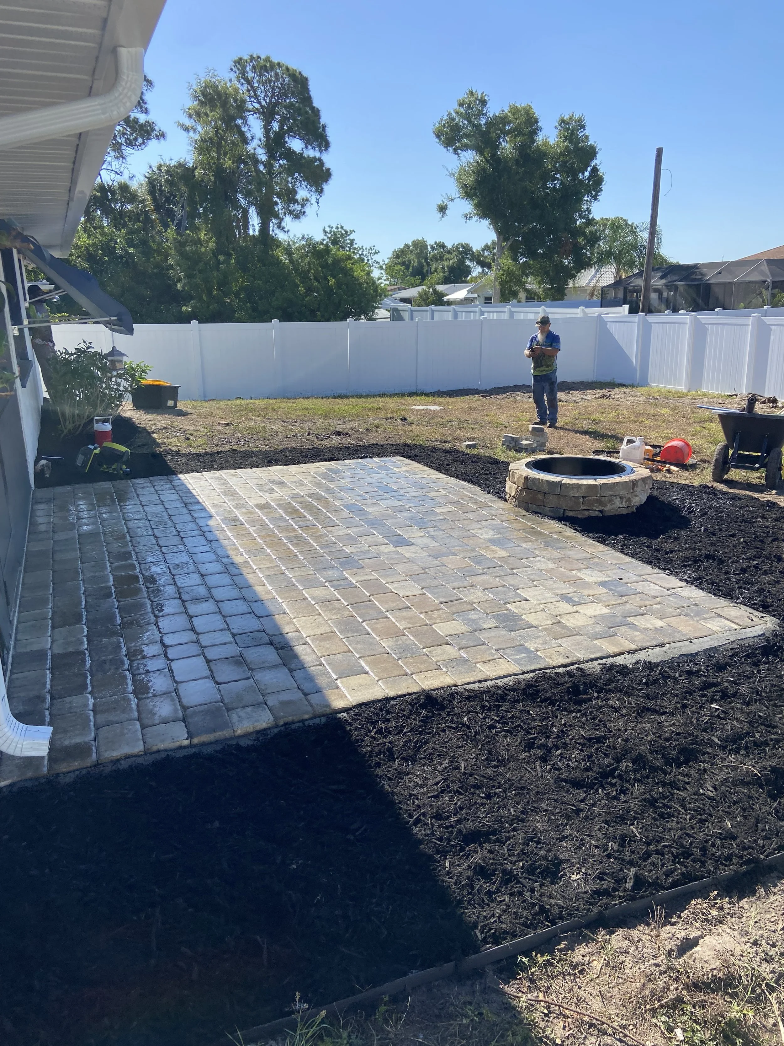 Backyard paver patio installed with fire pit in Port Charlotte, Fl.