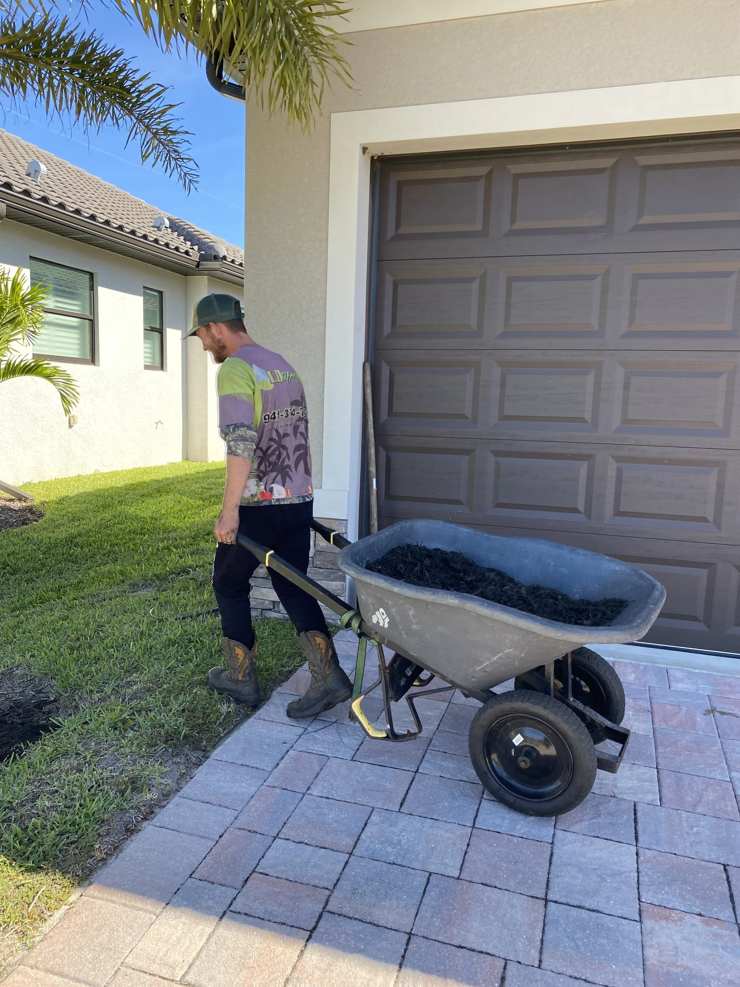 LD Lifestyles team installing mulch at Punta Gorda community.