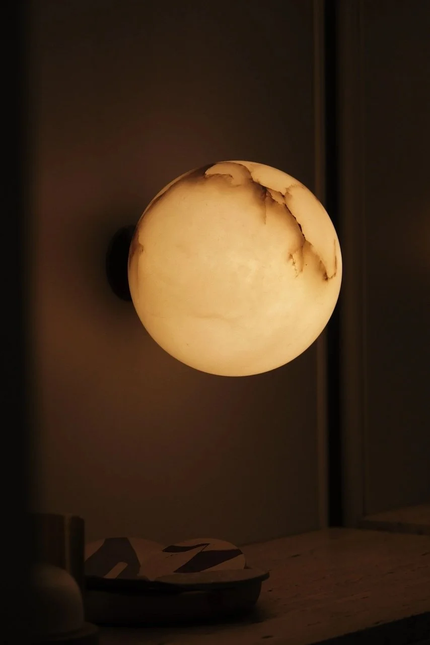 Contain. Lighting. Contain.se. Planet wall - alabaster. brass and glass. Handcrafted in Mallorca. ball light. ball lamp. wall lights.