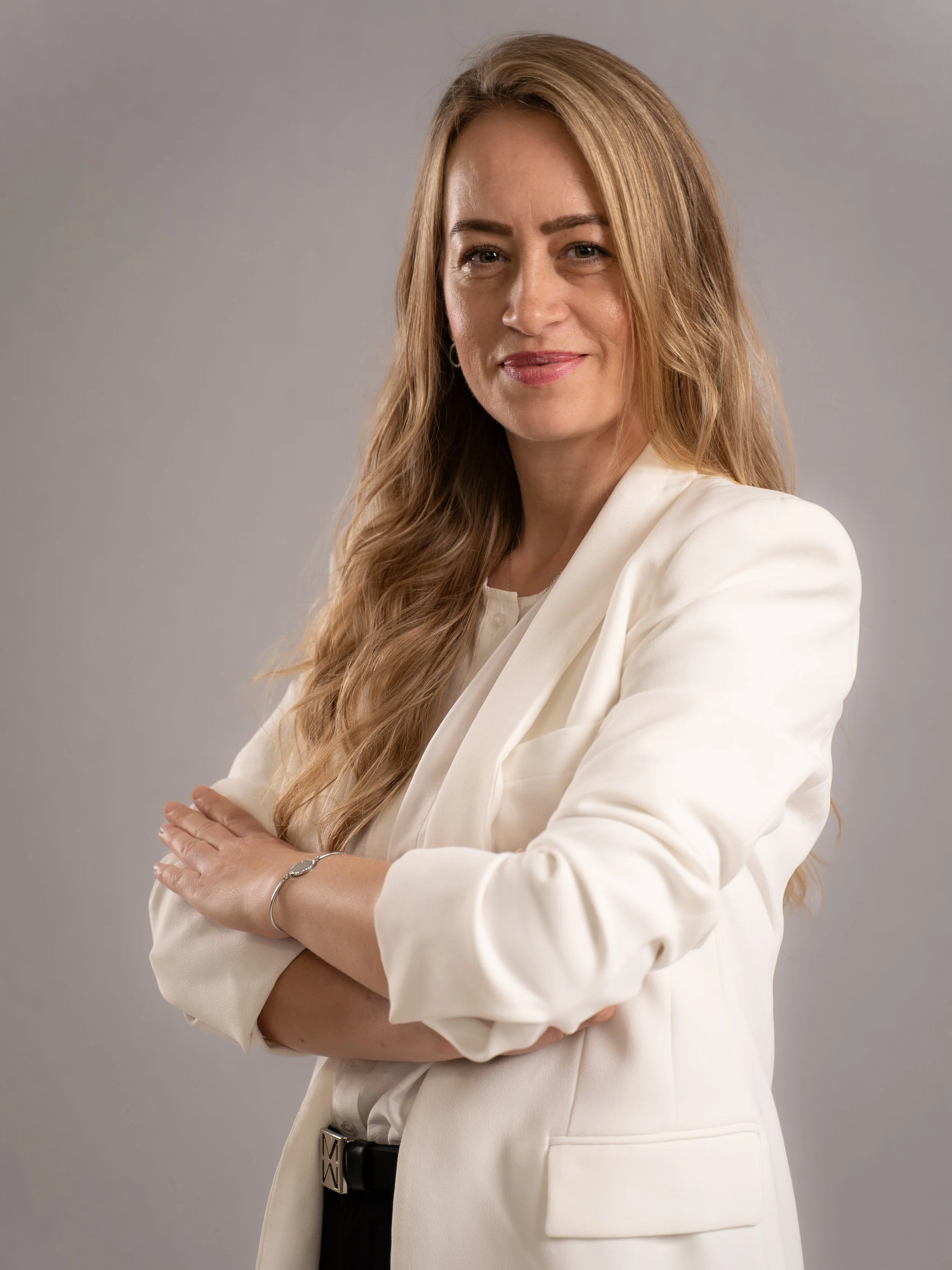 Professional executive portrait of a female CFO (Chief Financial Officer). Corporate headshot photography designed for leadership profiles, company websites, annual reports and LinkedIn.