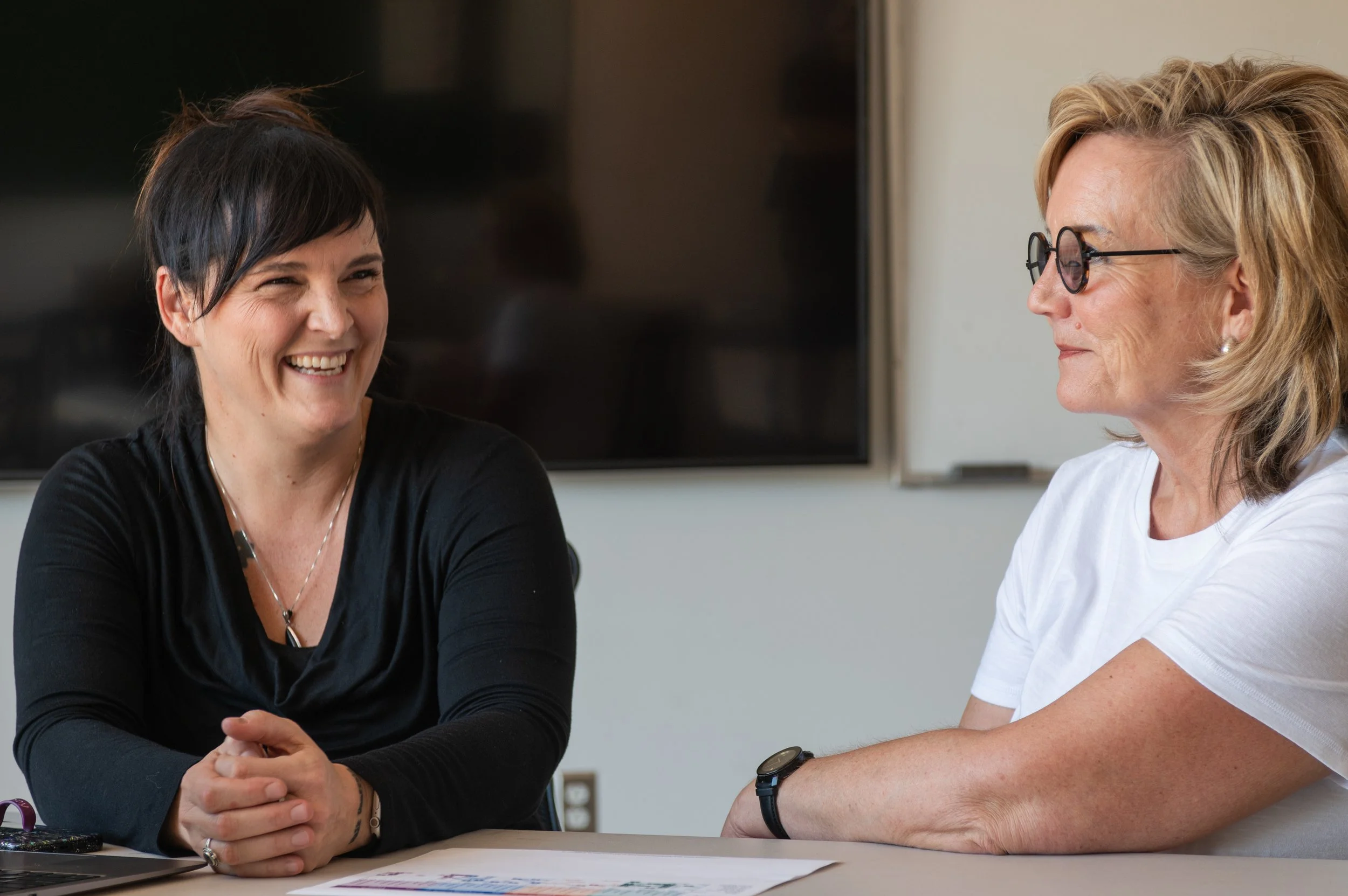 Leadership facilitator listening during a focused working conversation