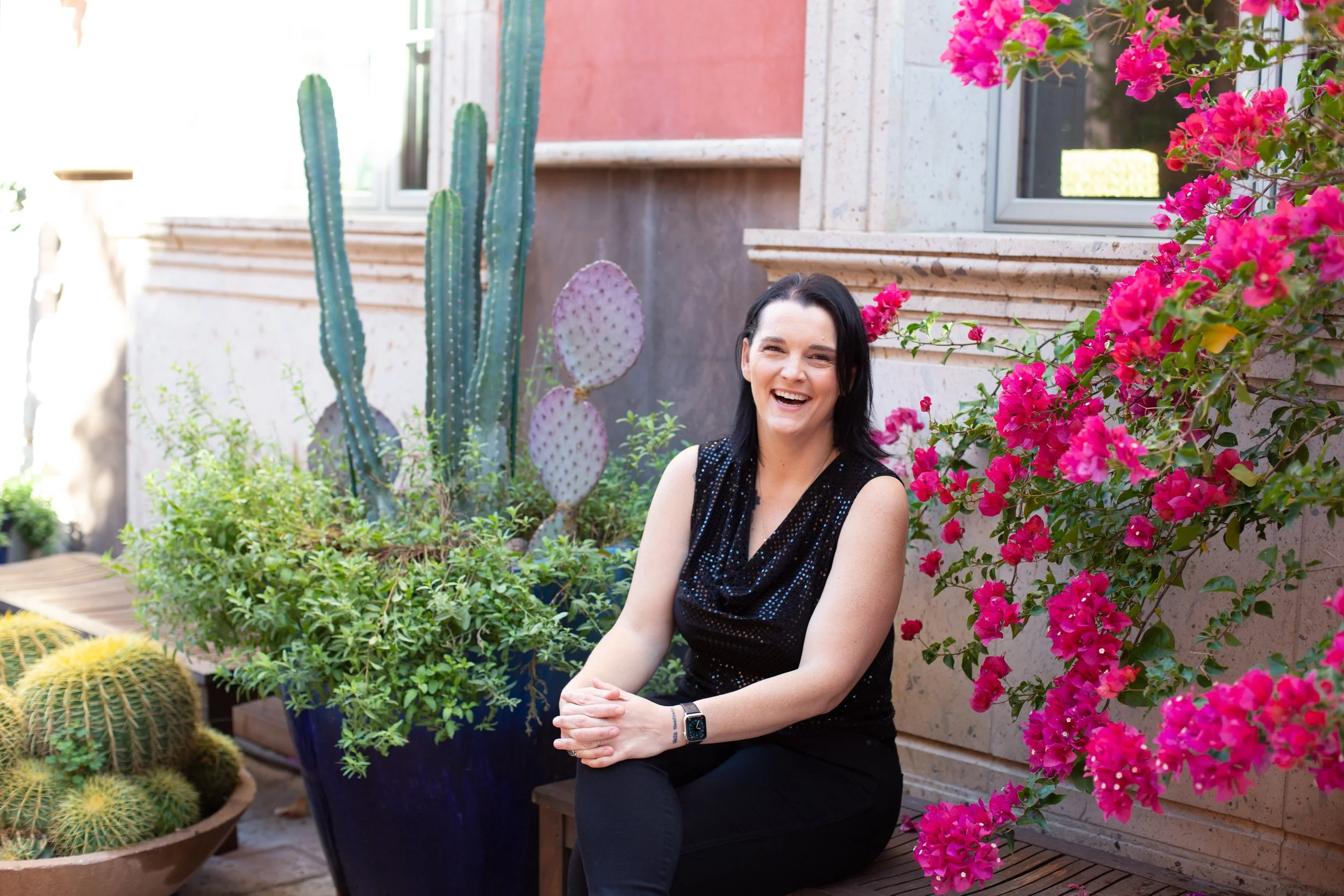 Leadership practitioner smiling while reflecting on responsibility and trust