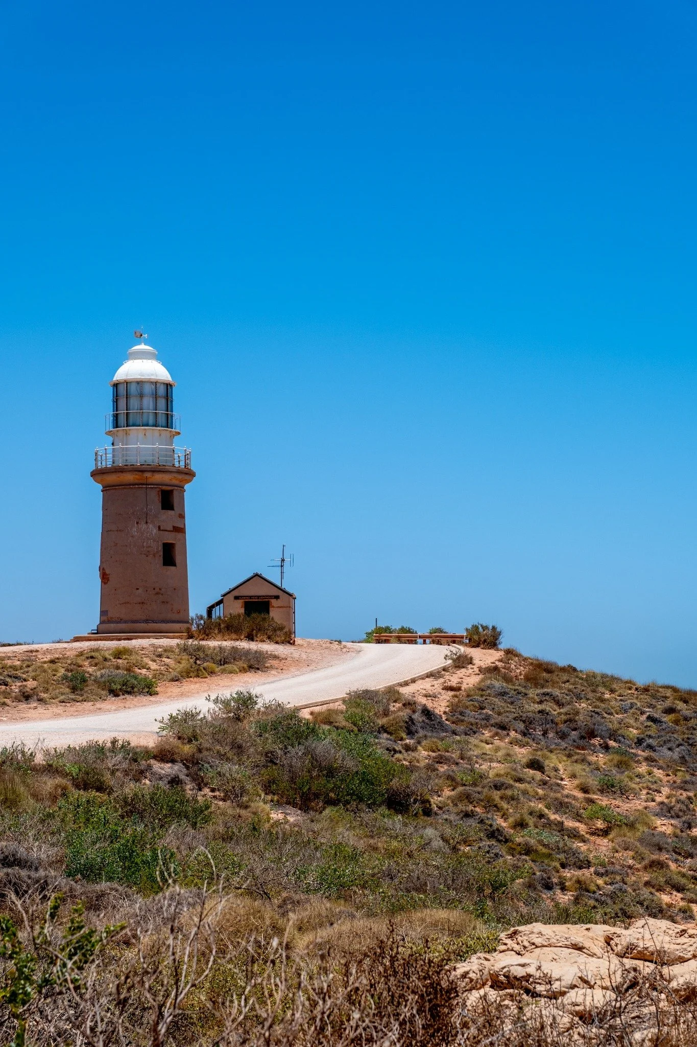 The Vlamingh Head Lighthouse has a bit of a history including almost not being built (was it not for the nearby Mildura wreck) It has been superseded by a bacon on Tower Two of the Harold E. Holt Communication Station VLF Towers but is maintained and