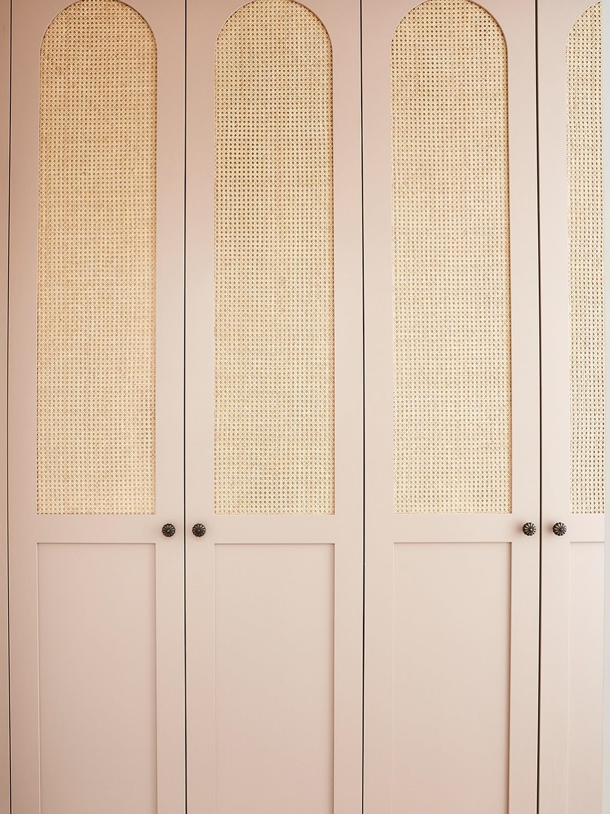 Sometimes the beauty is in the details. We&rsquo;re obsessed with these blush pink doors that really transform a functional piece into a real statement.