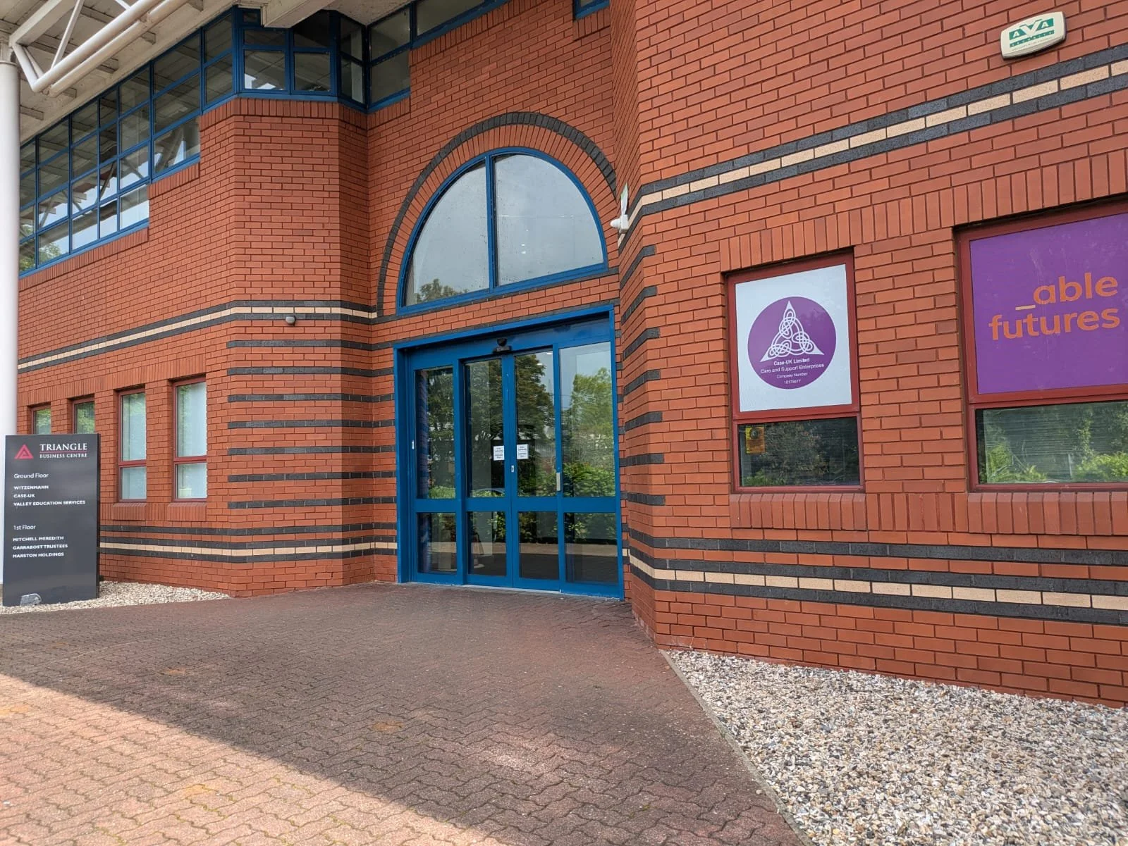 Photograph of the entrance of Triangle Building Centre where OH One Physiotherapy clinic is based alongside Case UK