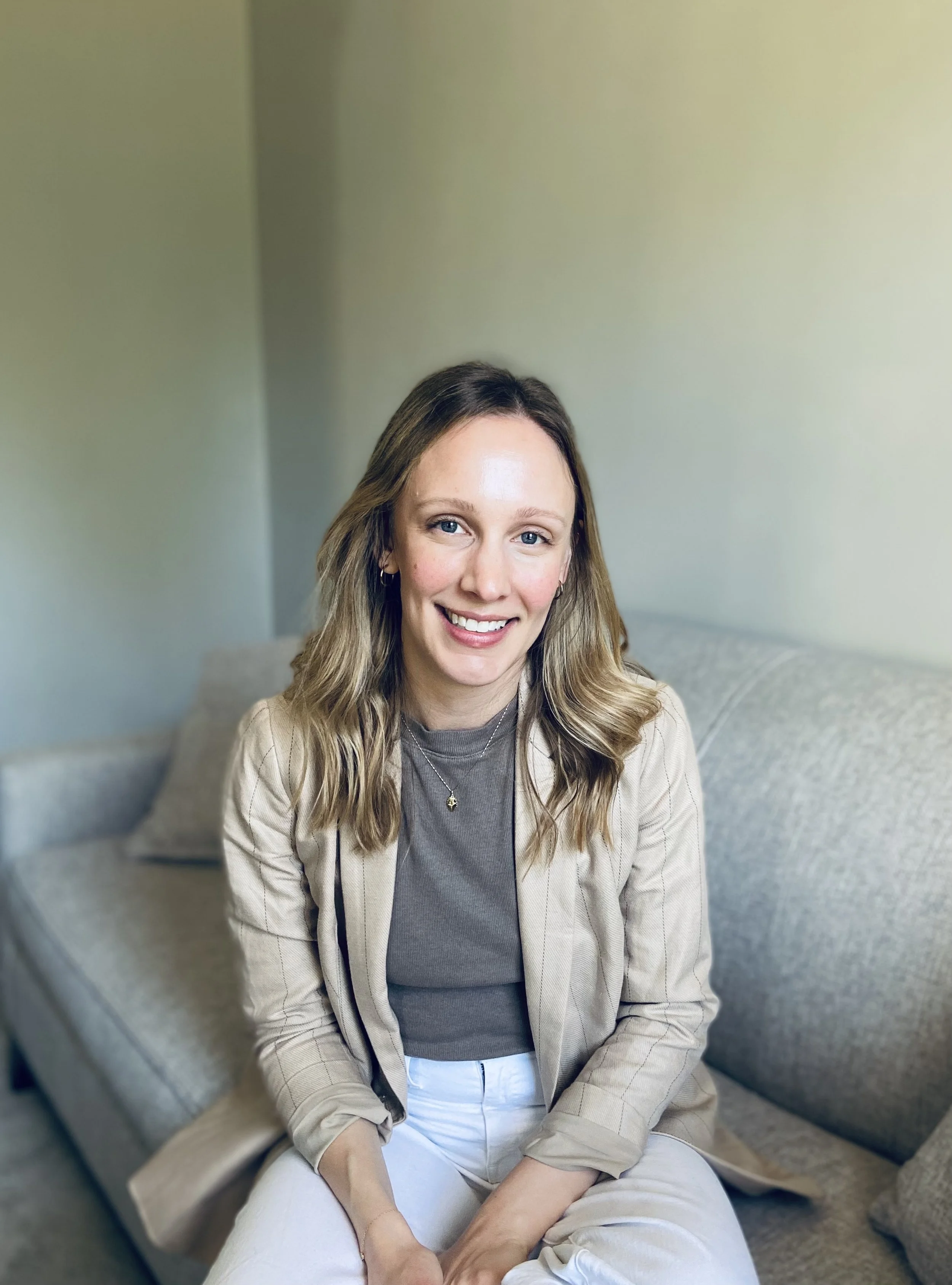Nicole Smith, LMHC, LPC, specializing in working with helping professionals and moms, in her home office in eastern Massachusetts, ready to see clients in Portland, Providence, Boston, and throughout OR, RI, and MA.