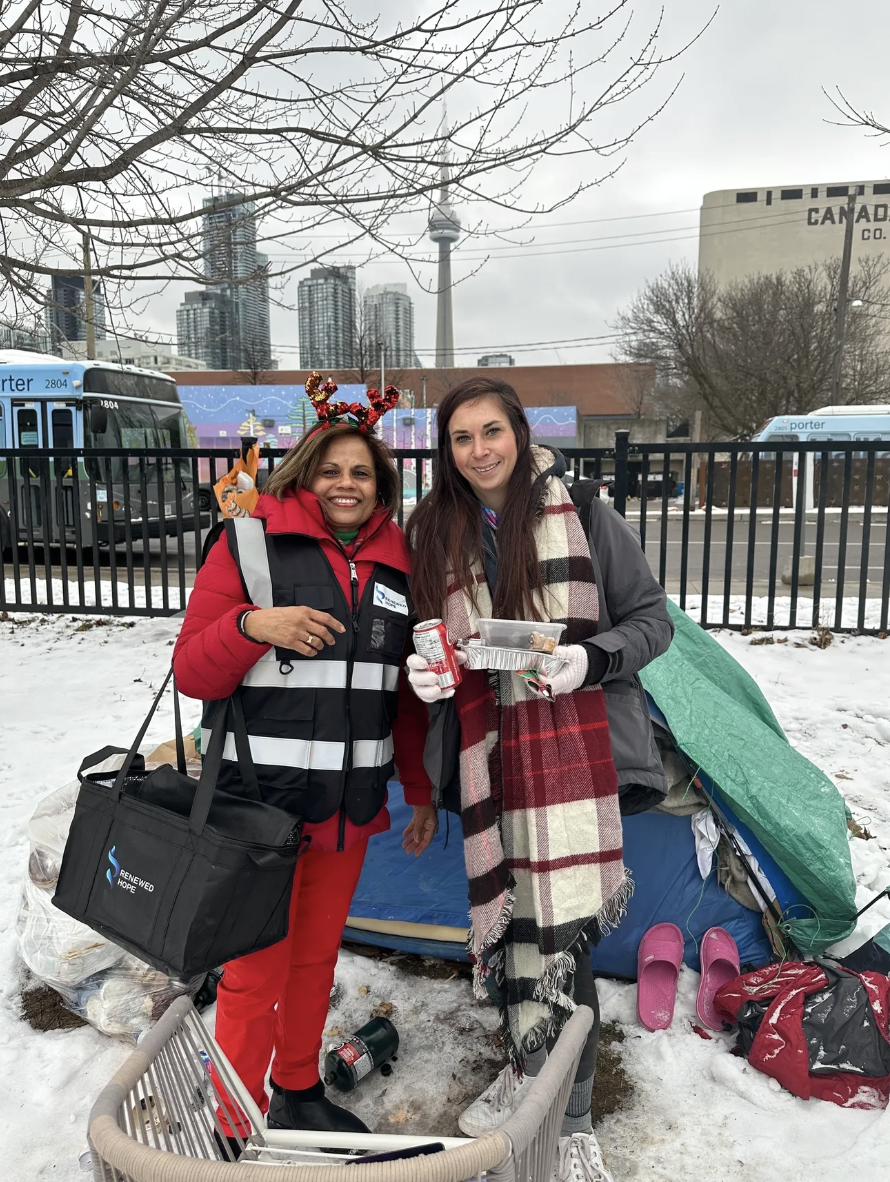 homeless-lady-living-in-tent-in-winter-smiling-getting-free-meal
