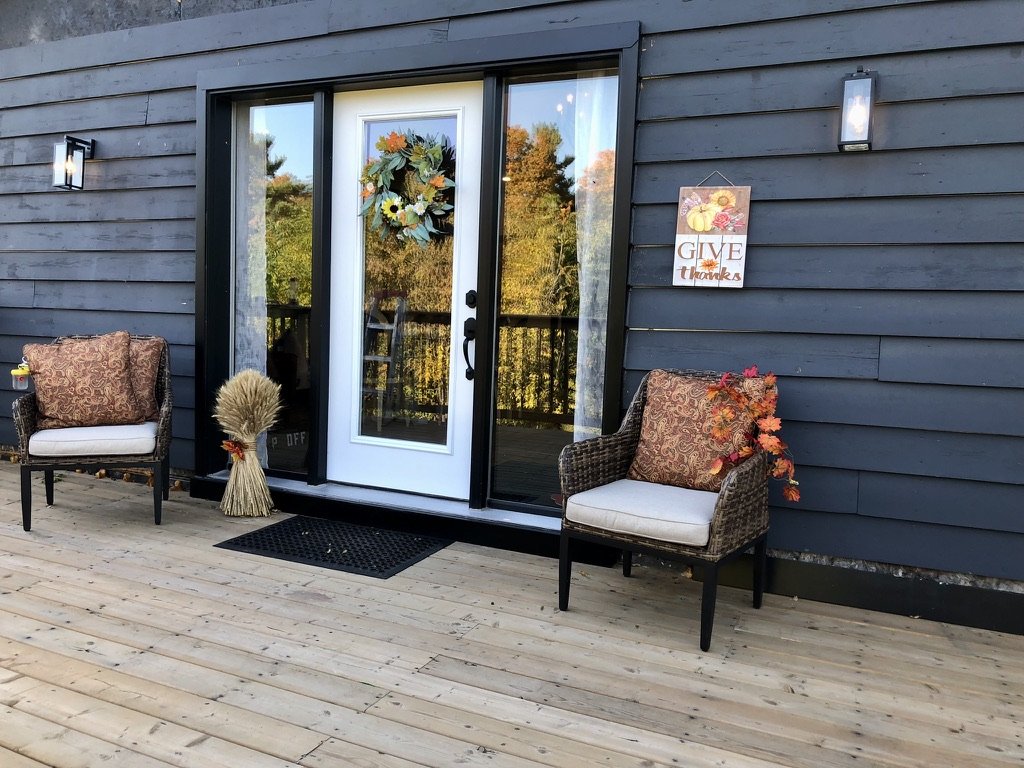 front-deck-of-retreat-house-with-cozy-seating
