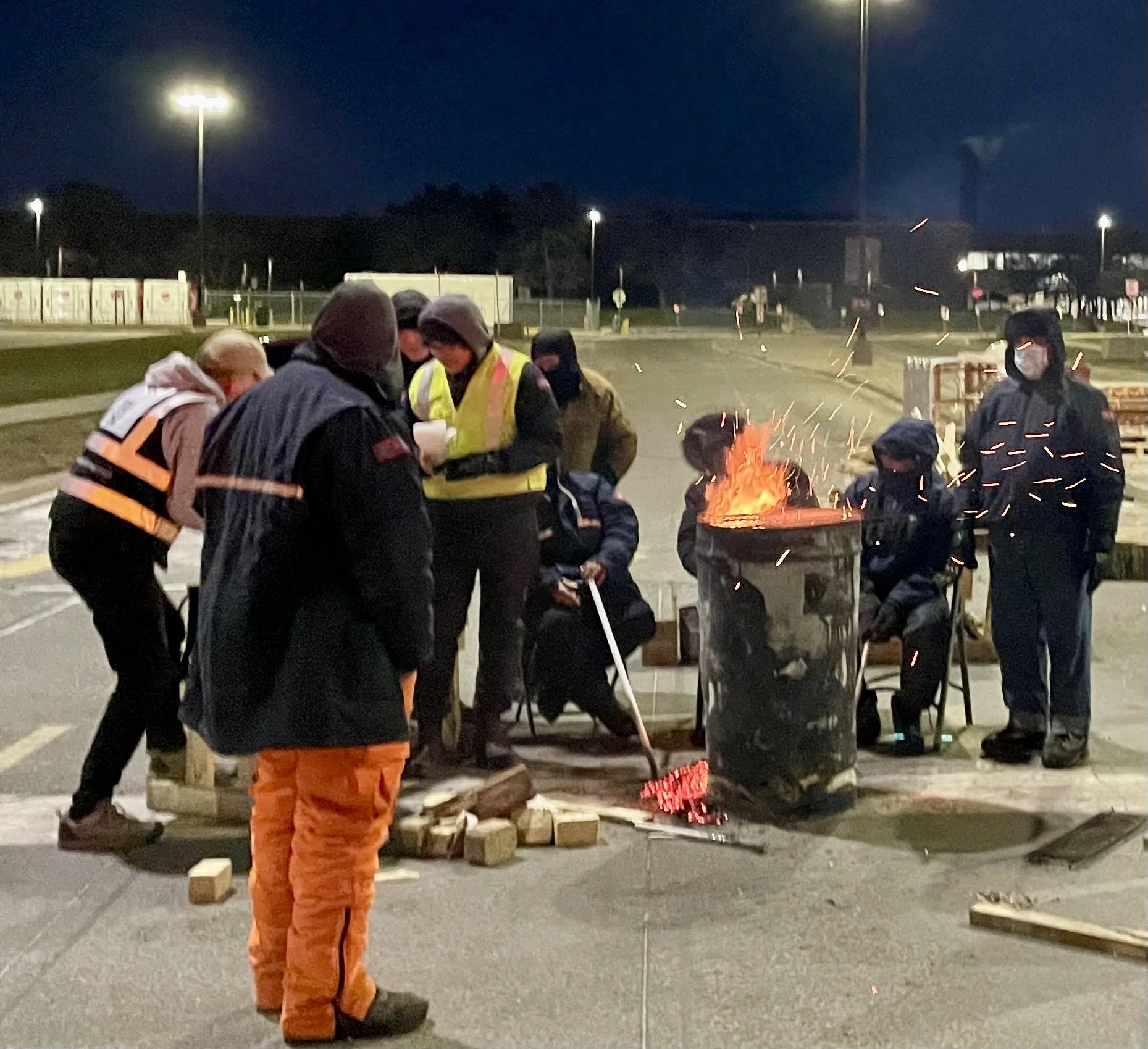 homeless-people-living-outside-at-night-receiving-essentials