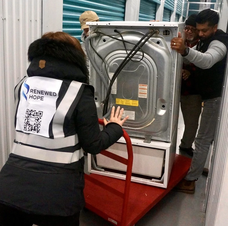 renewed-volunteers-moving-stove-for-special-project-for-a-senior-in-need