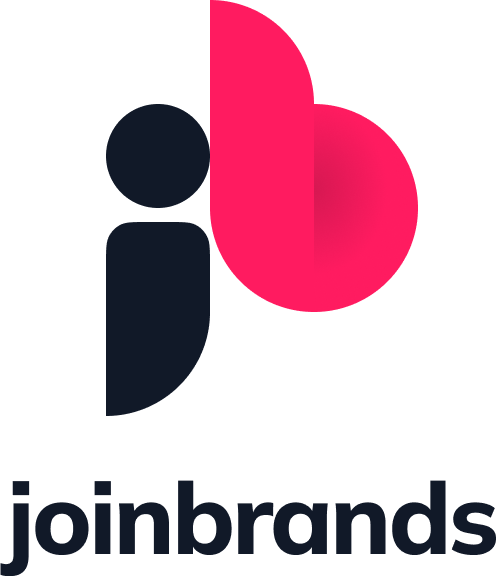 Close-up of the PlayStation logo, featuring a black square and circle with a pink background.