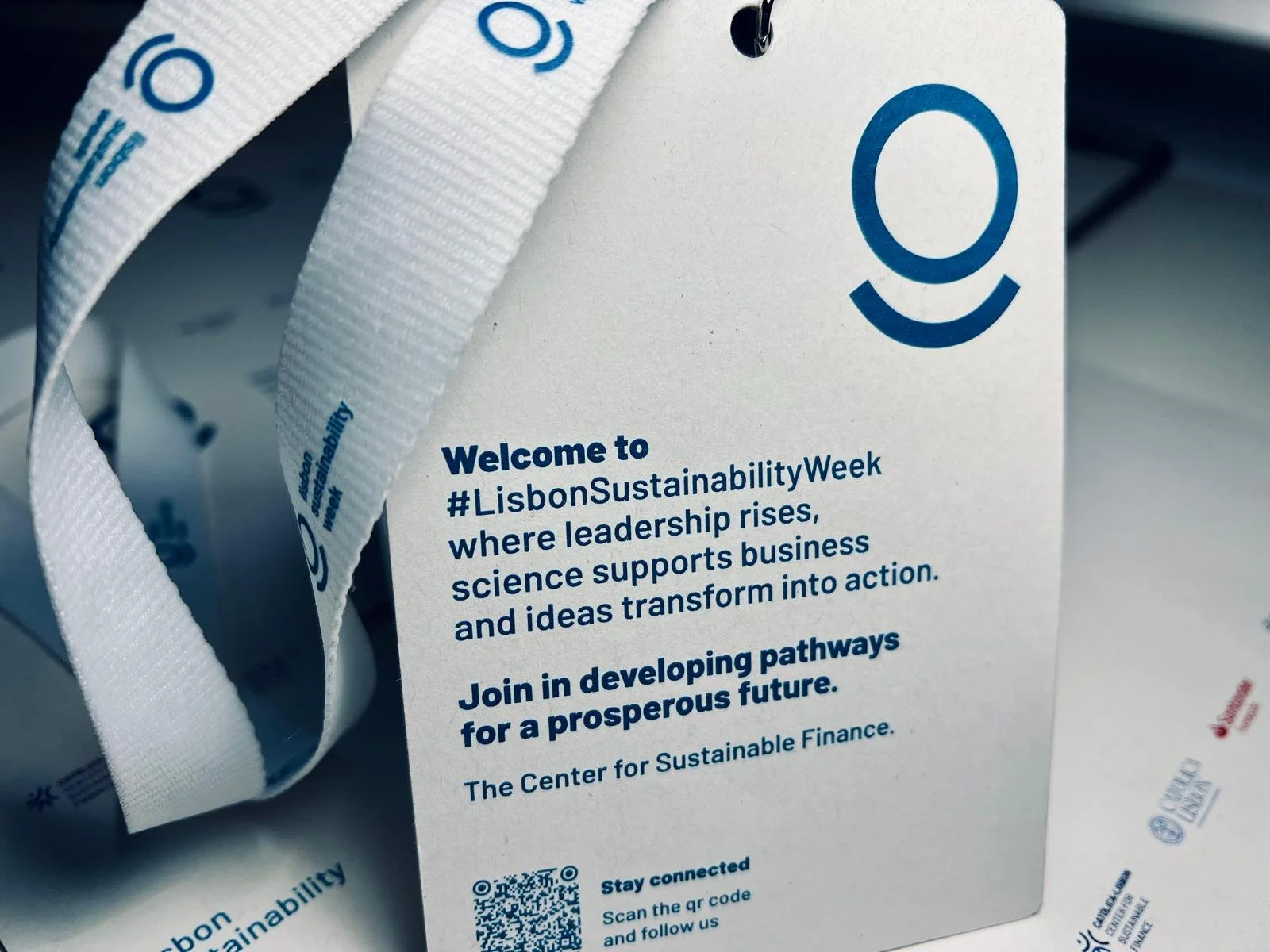 Event badge for Lisbon Sustainability Week featuring its logo, the slogan 'where leadership rises,' and a message inviting attendees to join developing pathways for a prosperous future, issued by the Center for Sustainable Finance.
