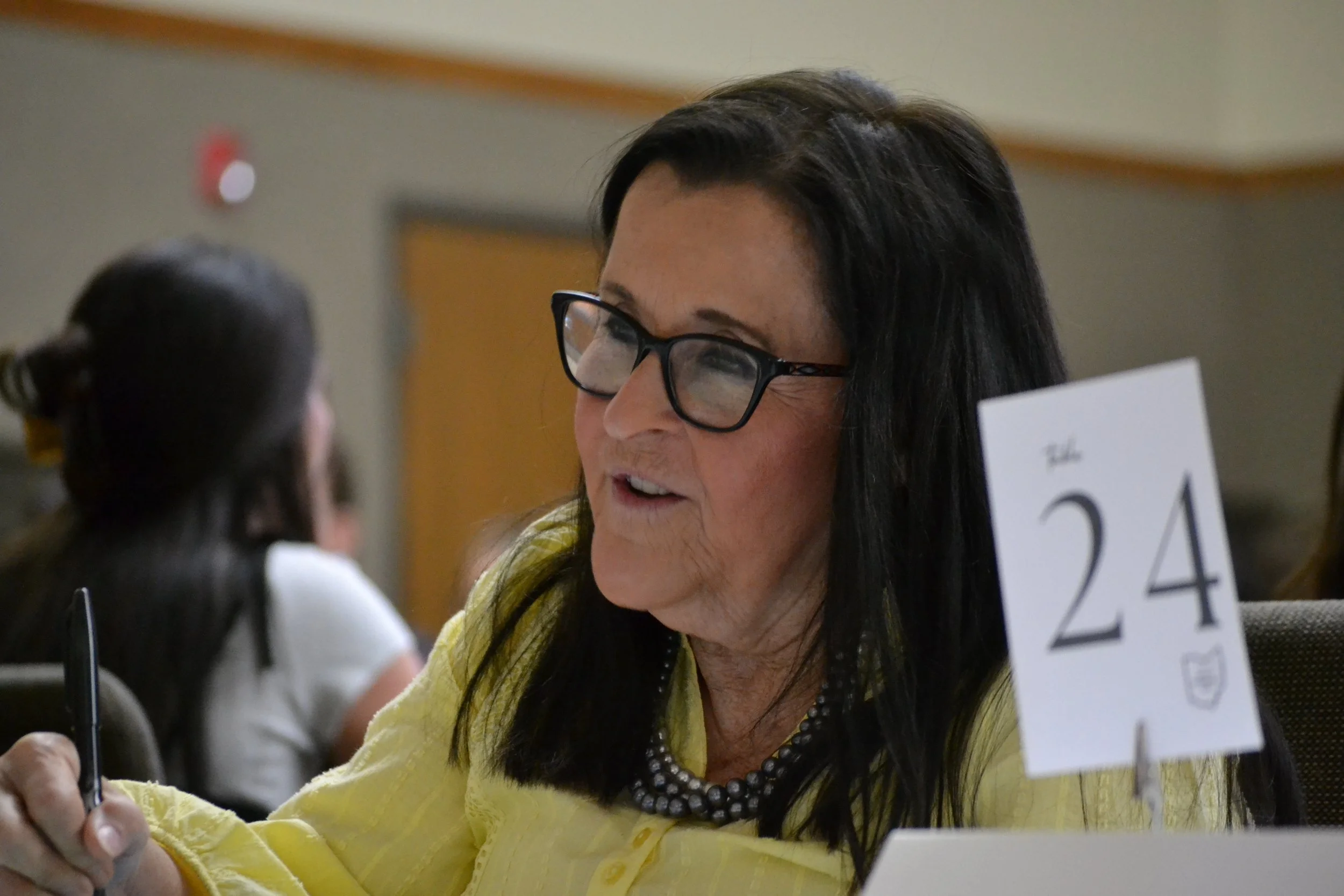 Education professional interviewing student during Raise the Bar mock interview.