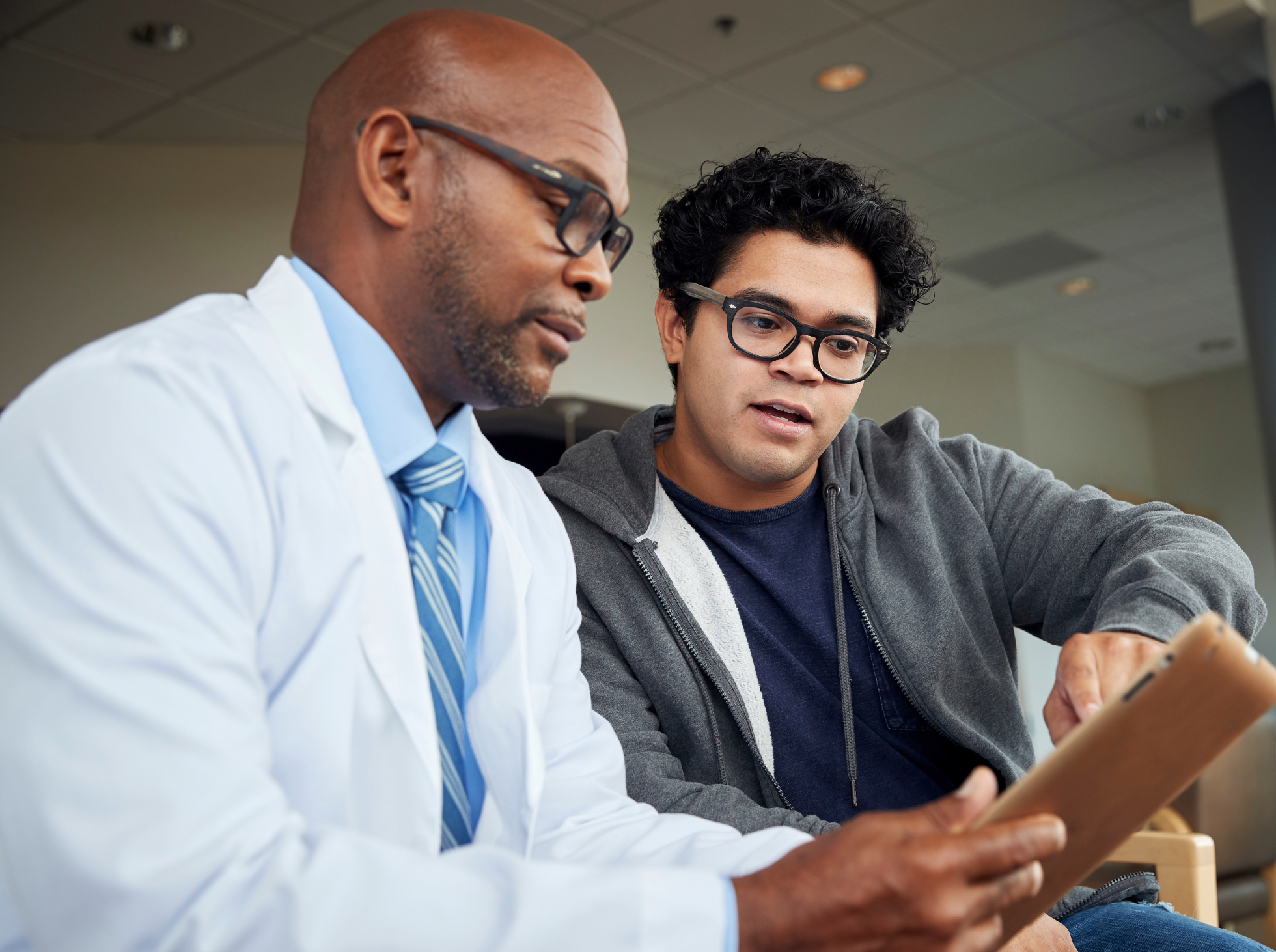 Male physician with male patient