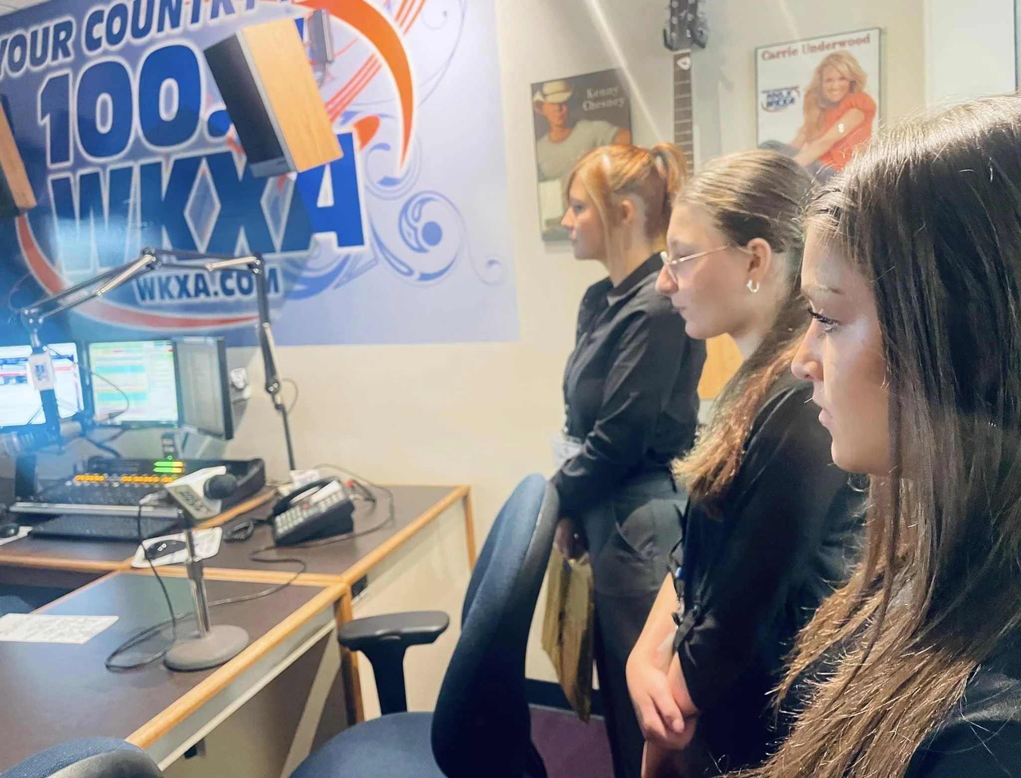 High school students in WKXA radio station booth during Raise the Bar Career Expo.