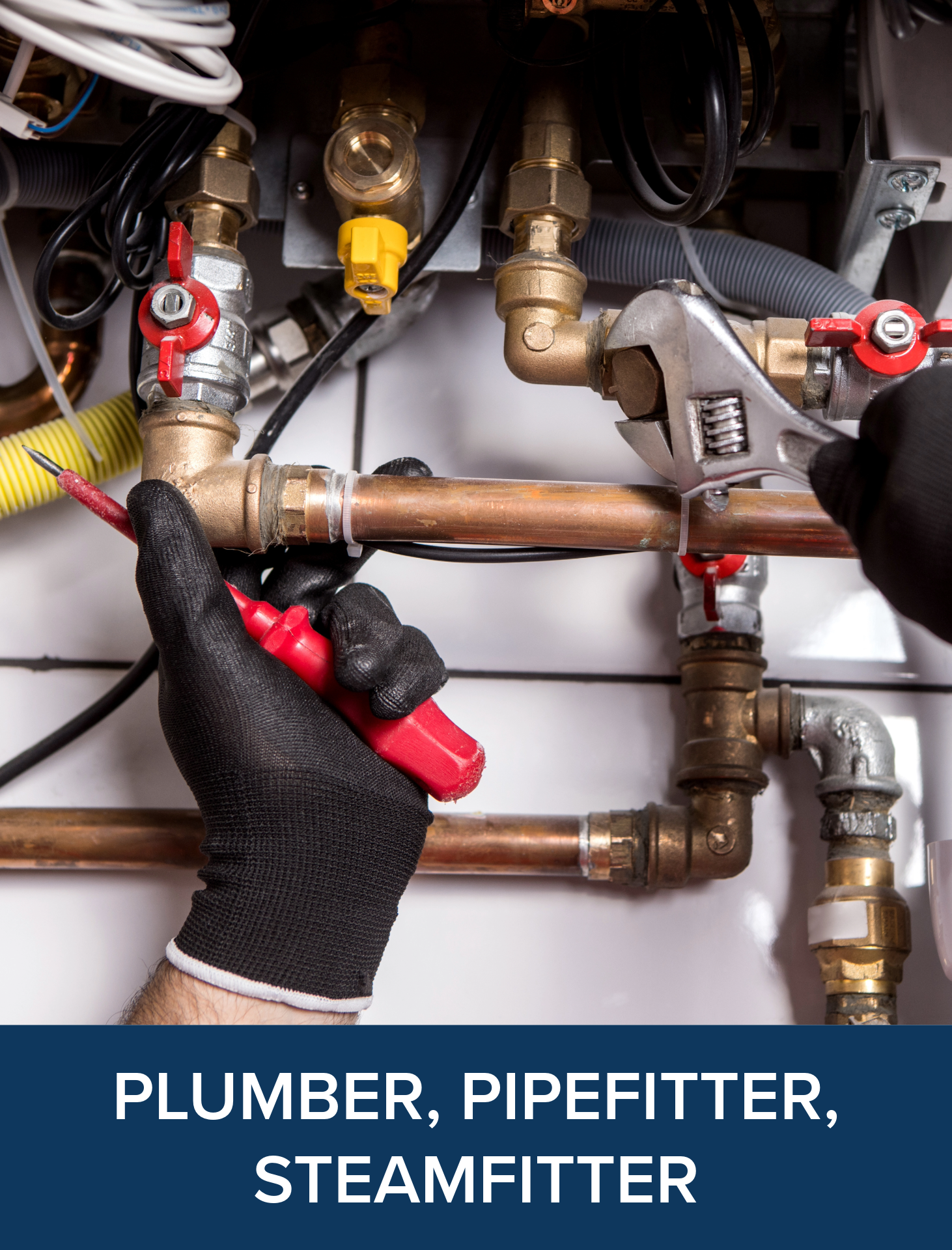 Person using pipe wrench on copper piping system.
