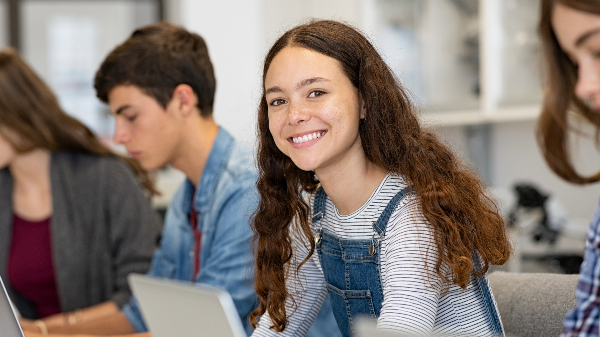 Female teenager smiling.