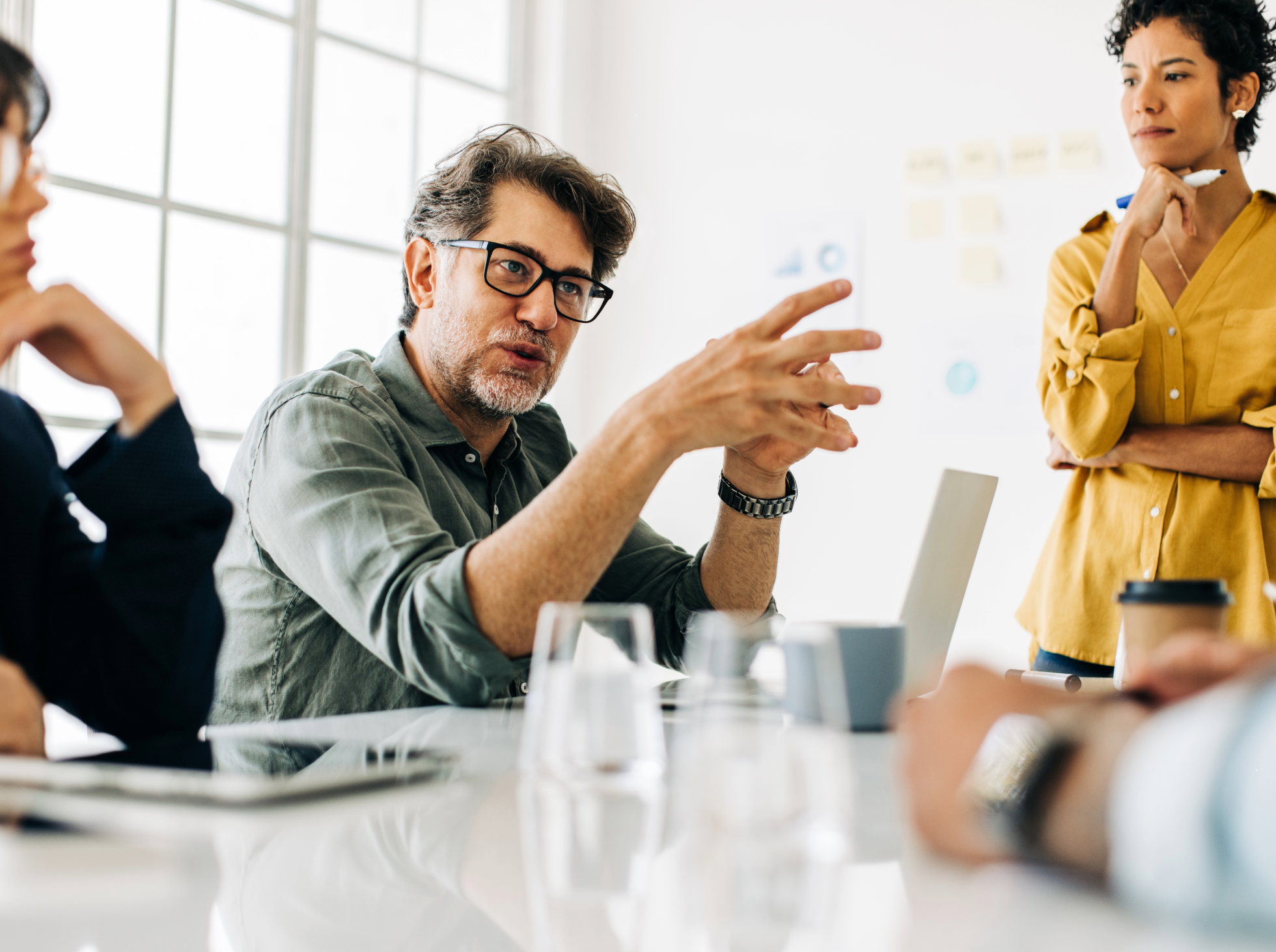 A group of professionals having a discussion in an office.