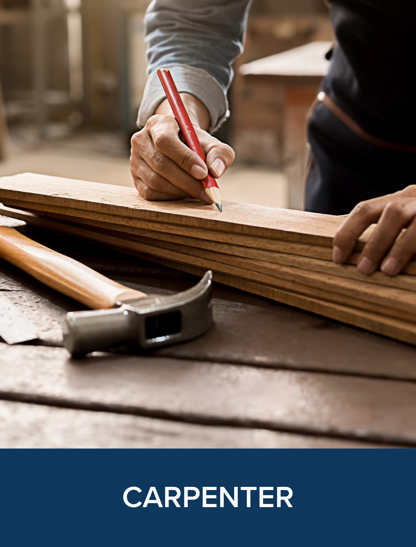 Person with woodworking tools and a hammer on a workbench in a carpentry workshop.