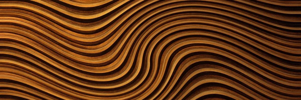 Close-up image of a wooden surface with wavy, layered grain patterns.