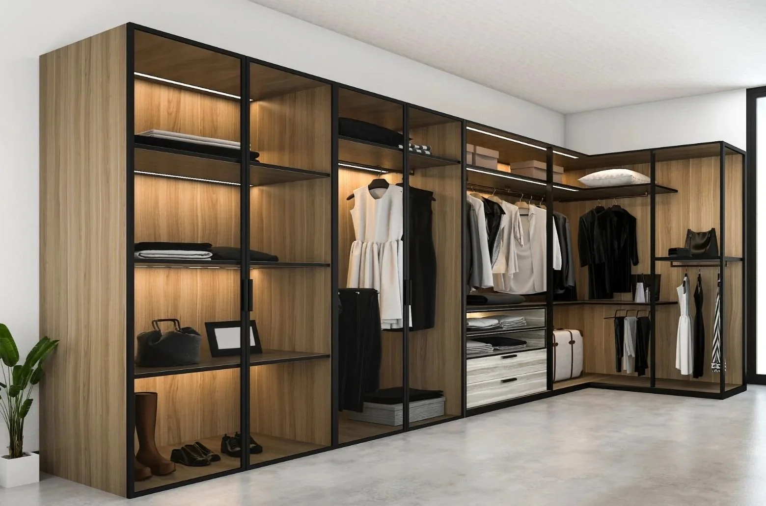 Modern walk-in closet with wooden shelves and black metal framing, containing hanging clothes, folded items, bags, shoes, and a plant in the corner.