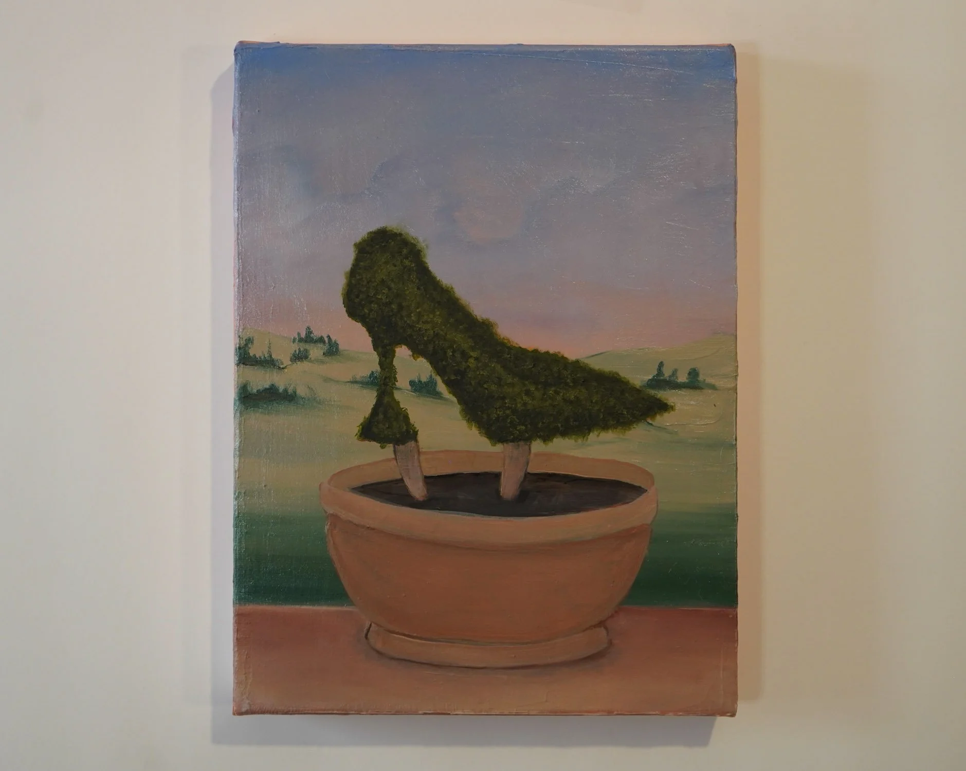 Installation view of “Consumed By Nature” in Kill Devil Hills by Sarah Rozell White, oil painting displayed on a gallery wall.