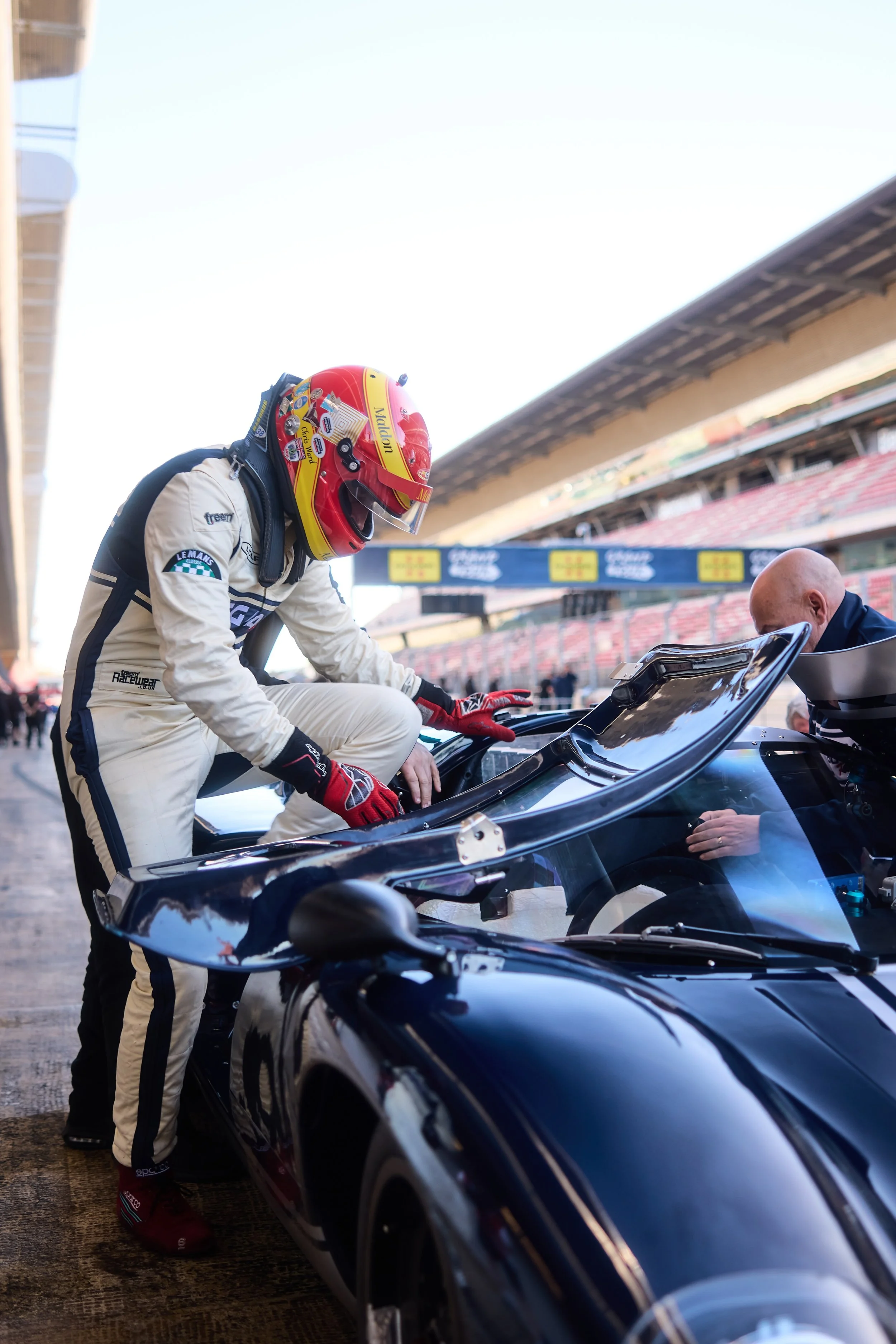 Chris Ward drops into the T70 cockpit. Barcelona, March 2026.