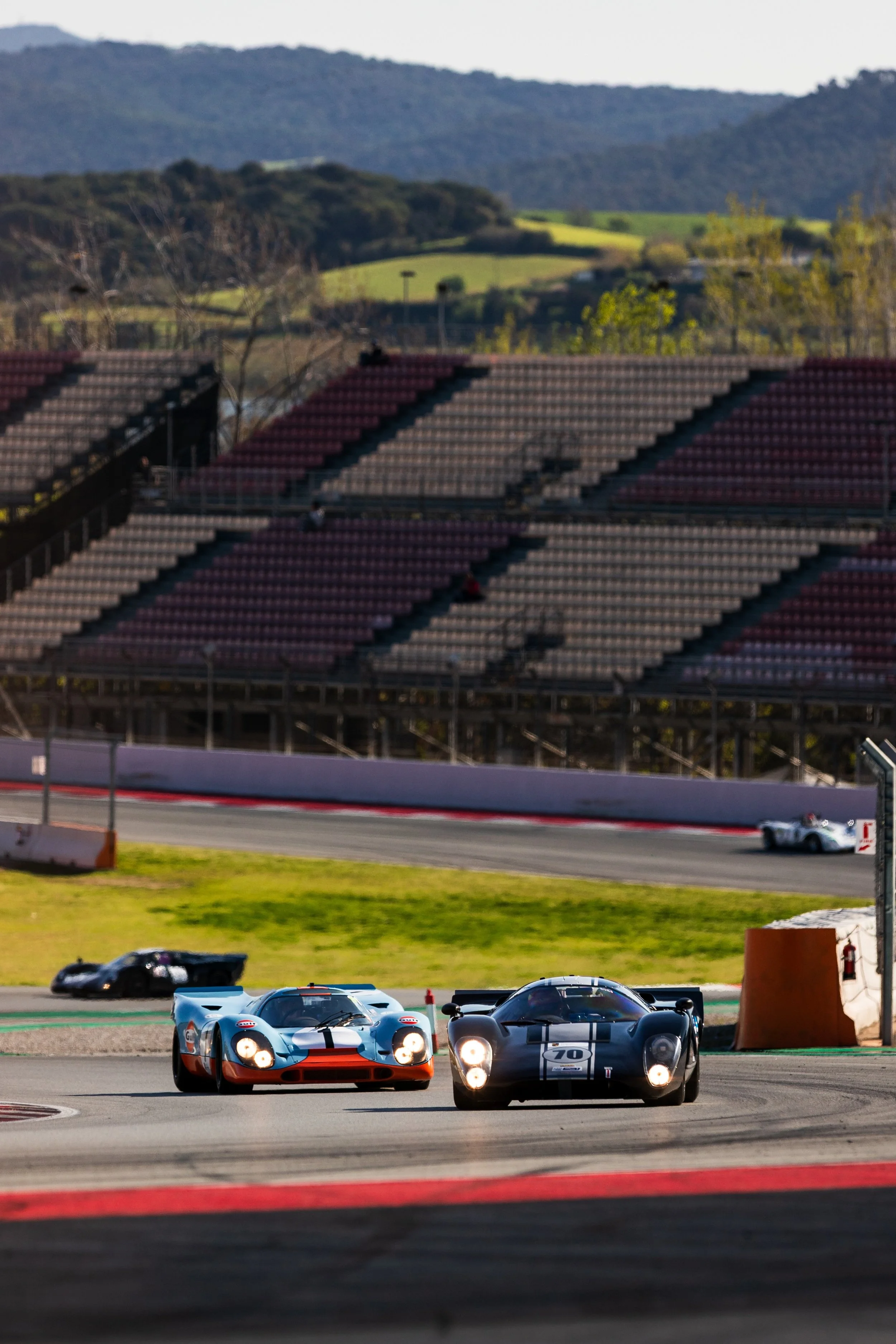 Car #70 leads the field through the grandstand section. Barcelona, March 2026.