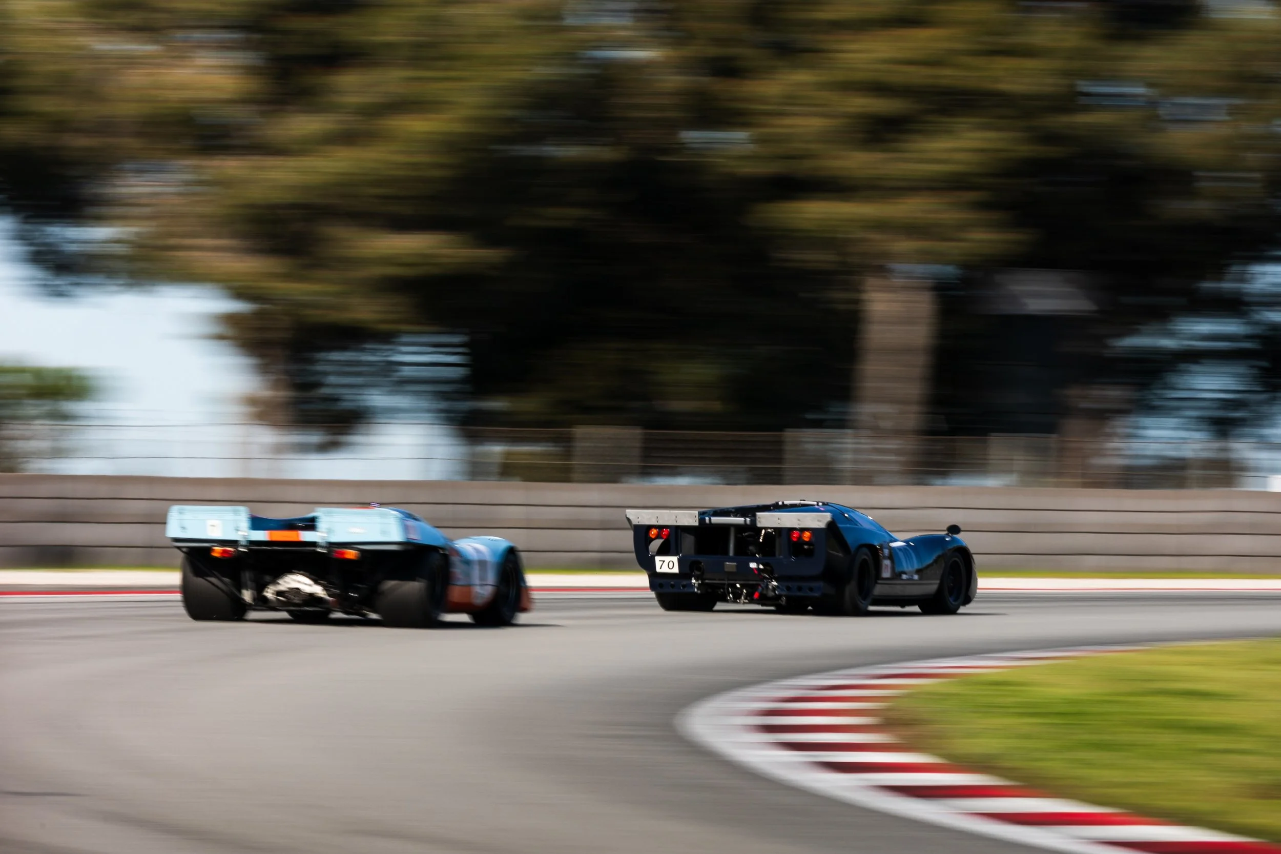 #70 alongside a Gulf-liveried T70. Historic sports car racing at its finest.