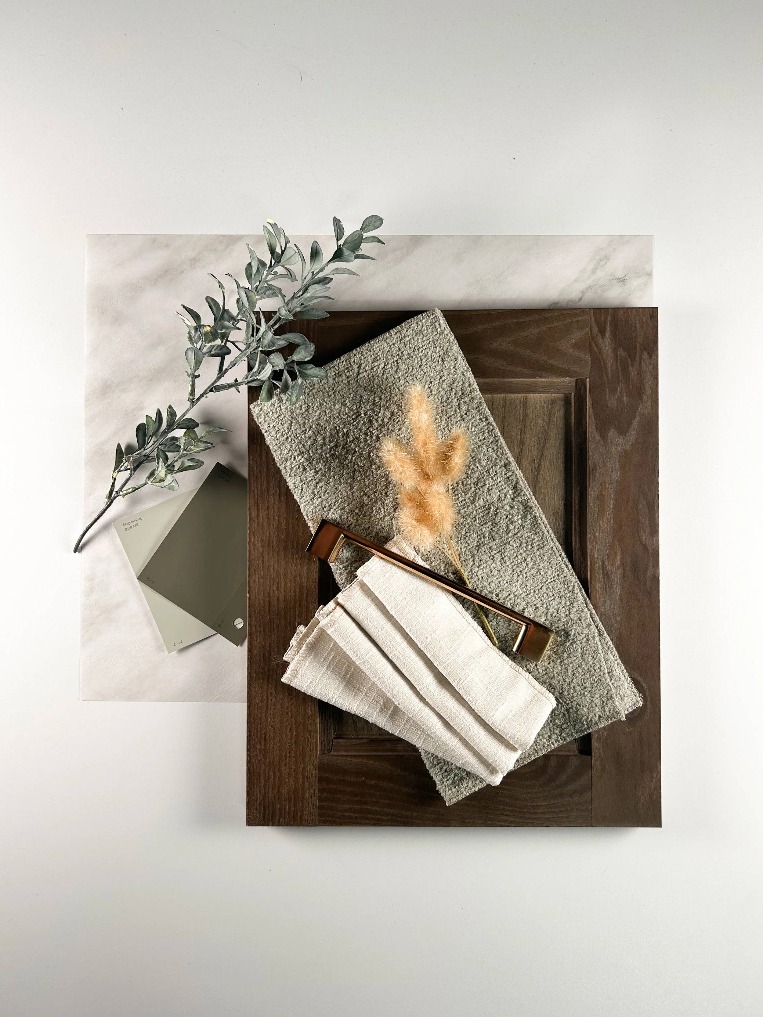 One of the first flat lays that I created! I am naturally drawn to the darker woods and green accents, so this design was created from my personal interests. 