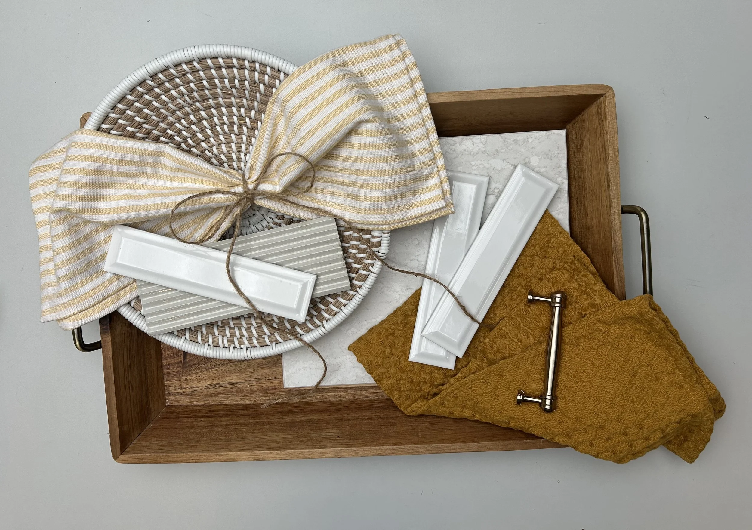 This flat lay was inspired by the previous farm house vibe! Trying to come up with unique ways to lay fabric, I tried tying the yellow and white stripped fabric into a bow. 