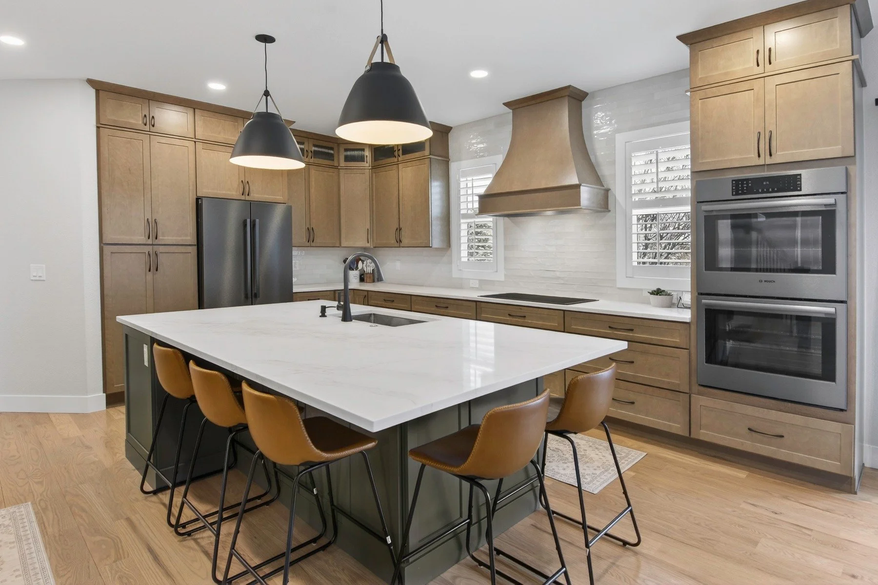 We've had such fun looking through the before and after photos for our Wildgrass remodel in Broomfield. This floor plan had plenty of counter space, but lacked function and flow. We removed the peninsula to improve traffic from the eat-in nook to the