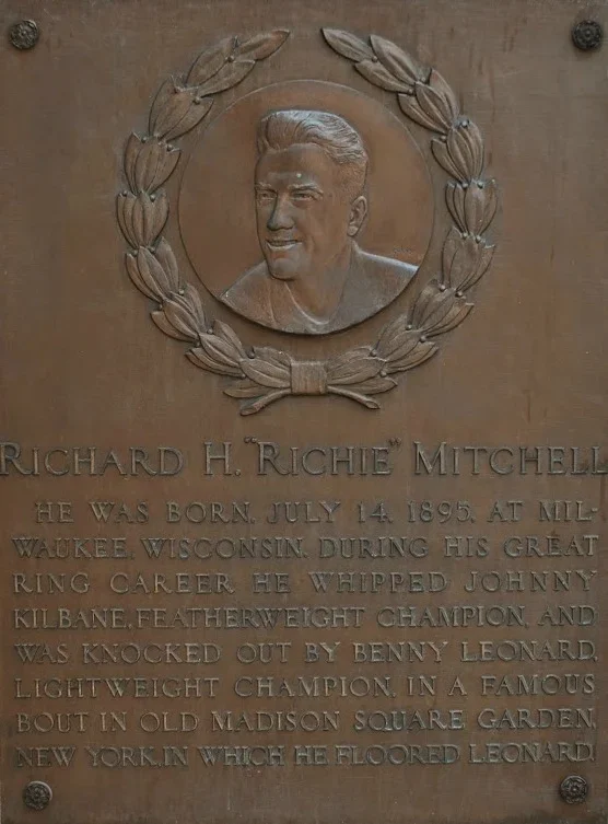 Plaque with a portrait of Richard H. Richie Mitchell and text about his life and boxing career.