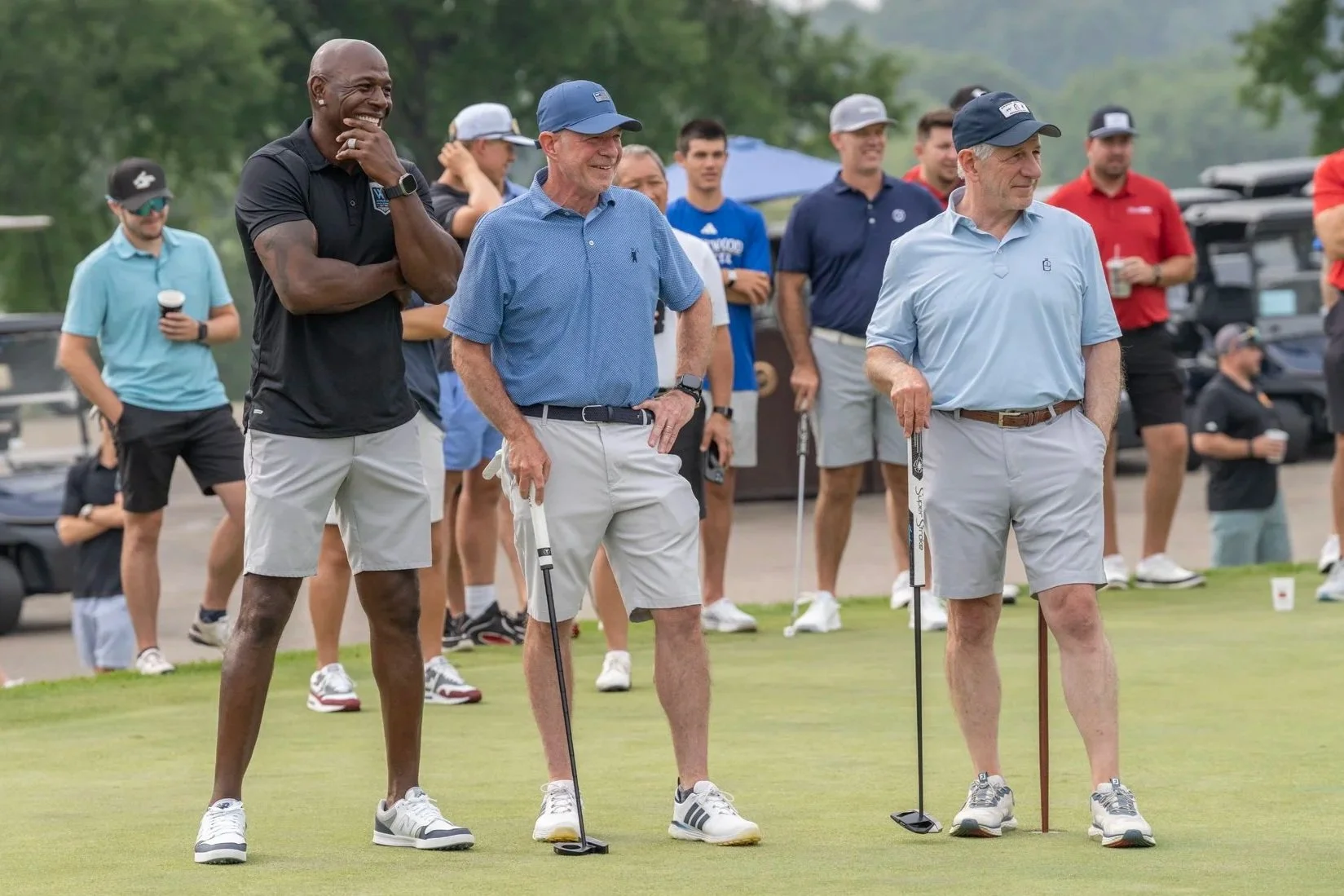 Donald Driver, David Marcus, and Greg Marcus watch a putting competition during the Wisconsin Athletic Hall of Fame Golf outing 2026