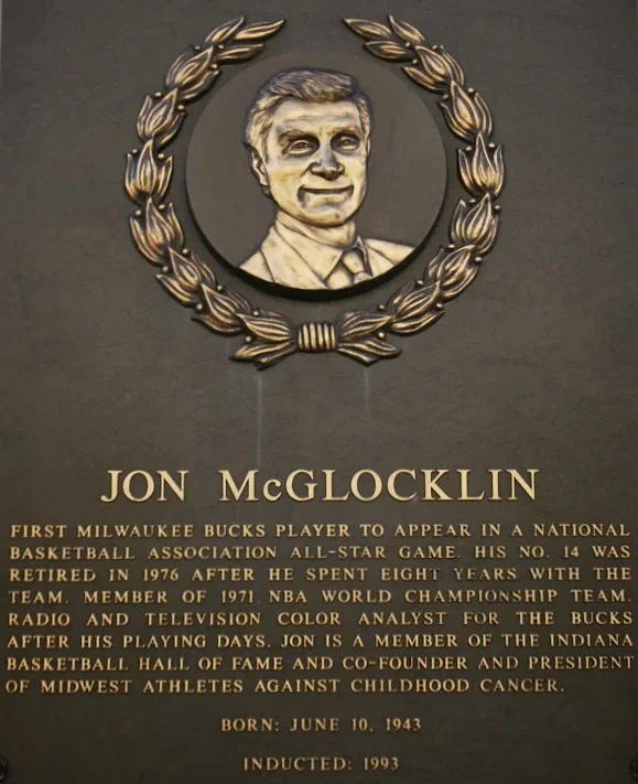 Plaque tribute to Jon McGlocklin, former Milwaukee Bucks basketball player, born June 10, 1943, inducted into the Hall of Fame in 1993.