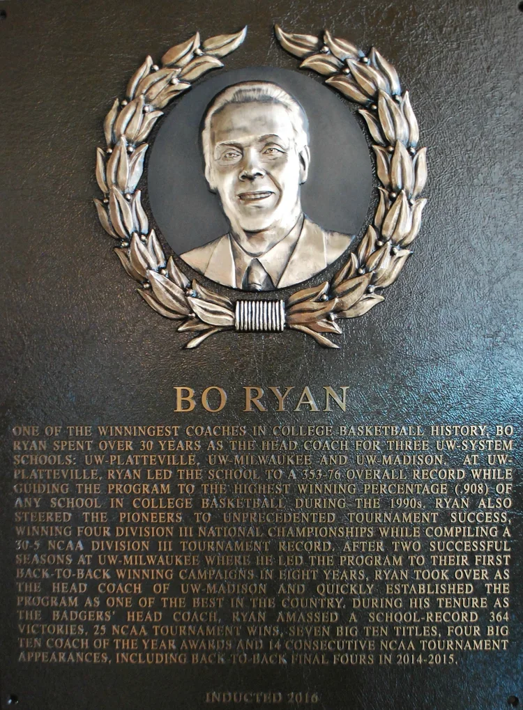 Plaque with a portrait of Bo Ryan surrounded by a laurel wreath. Below, a detailed description of his achievements and history as a college basketball coach.