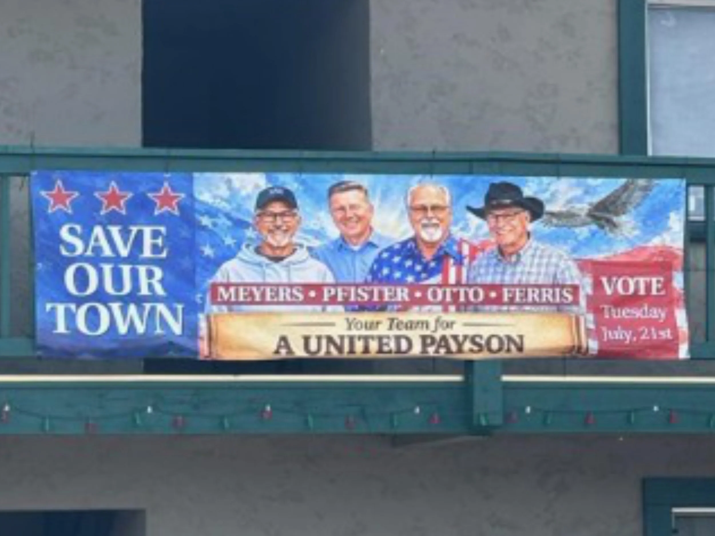 Save Our Town - Banner on the Roundup Building close