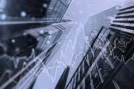 A modern glass building with financial graphs and data charts overlaid.