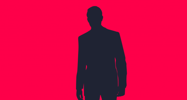 Silhouette of a finance leader in a suit against a bright pink background.