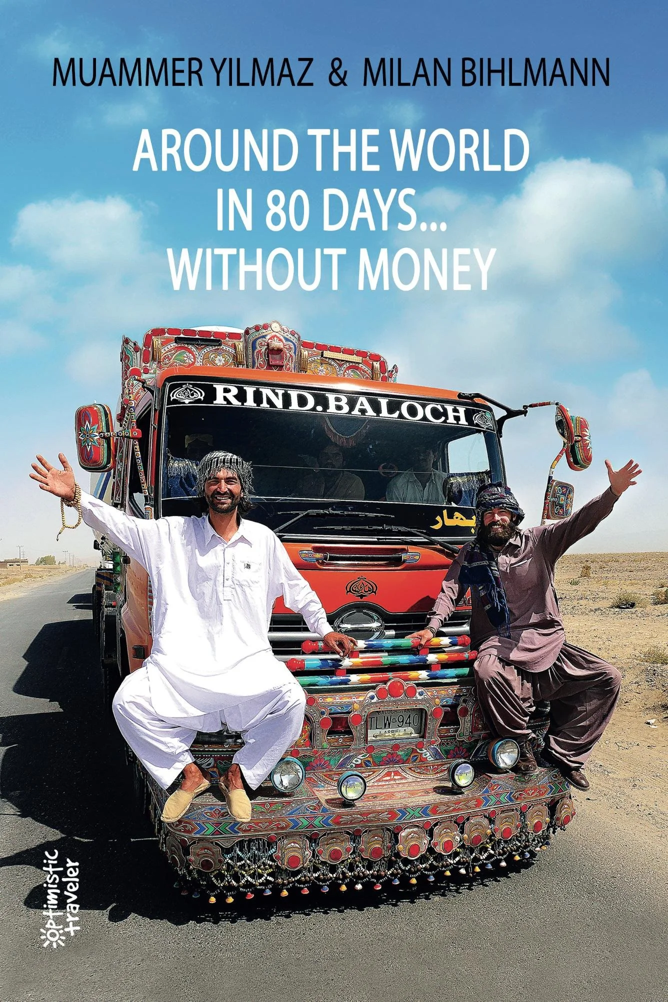 Men dressed in traditional South Asian clothing sitting on a vibrantly decorated auto rickshaw in a desert landscape, with a blue sky and clouds in the background.