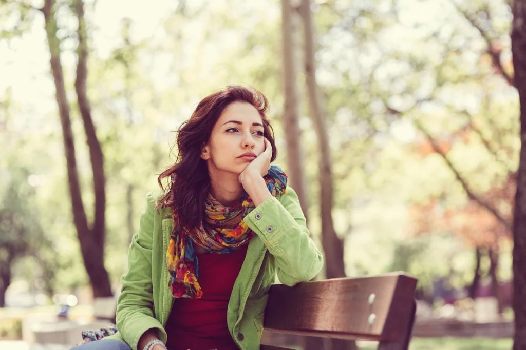 Woman on bench feeling stuck